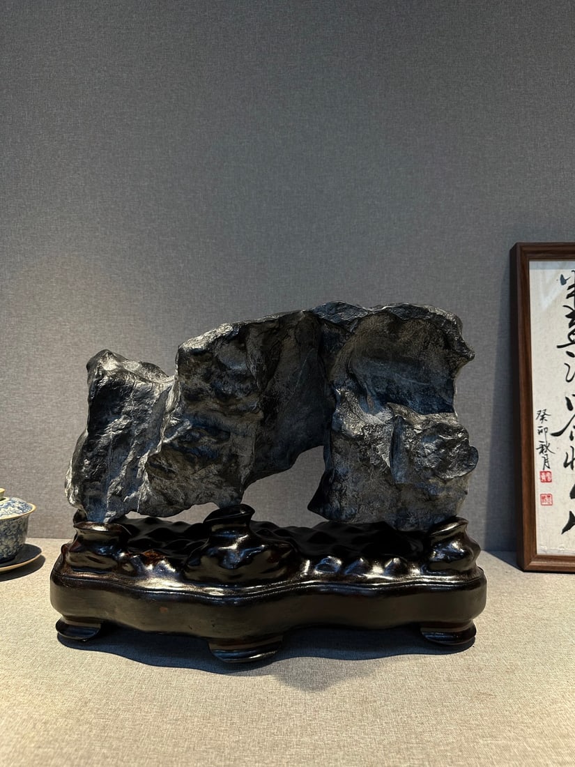 An Exquisite Lingbi Stone Ornament: An Exquisite Lingbi Stone Ornament Qing Dynasty, China Size:17.3inx13inx8.7in灵璧石龙门窟摆件 中国清代 Size:44cmx33cmx22cm