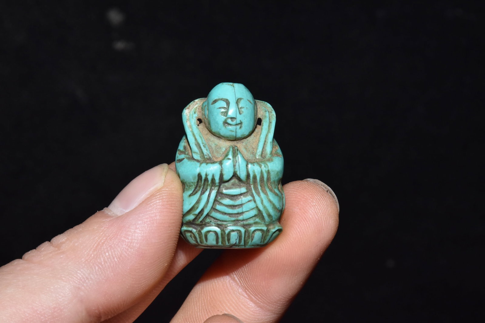 An Exquisite Turquoise Buddha Statue: An Exquisite Turquoise Buddha Statue Liao Dynasty, China Size:1.4inx0.8in Weight:10g绿松石佛像 中国辽代 Size:3.5cmx2cm Weight:10g