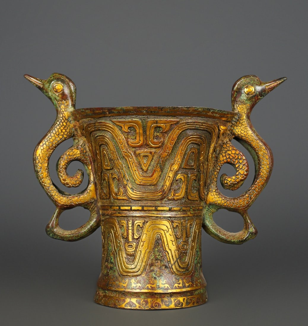 An Exquisite Bronze Double-Ears Cup: An Exquisite Bronze Double-Ears Cup Han Dynasty, China Size:13inx11in Weight:3500g青铜双凤鸟杯 中国汉代 Size:33cmx28cm Weight:3500g