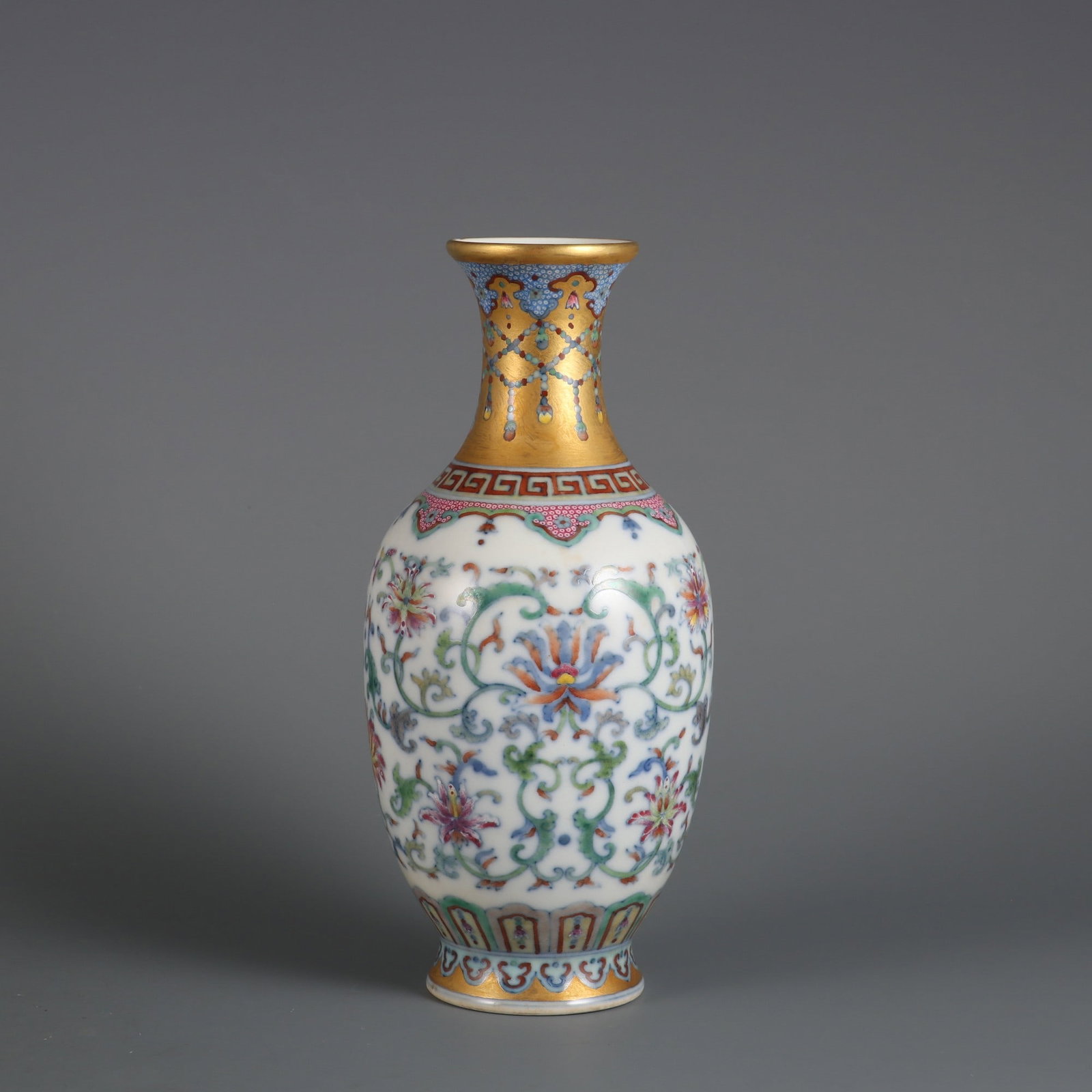 An Exquisite Doucai Lotus Pattern Vase: An Exquisite Doucai Lotus Pattern Vase Qing Dynasty, China Qianlong Six-character Mark Size:8inx3.5in金地斗彩缠枝莲纹赏瓶