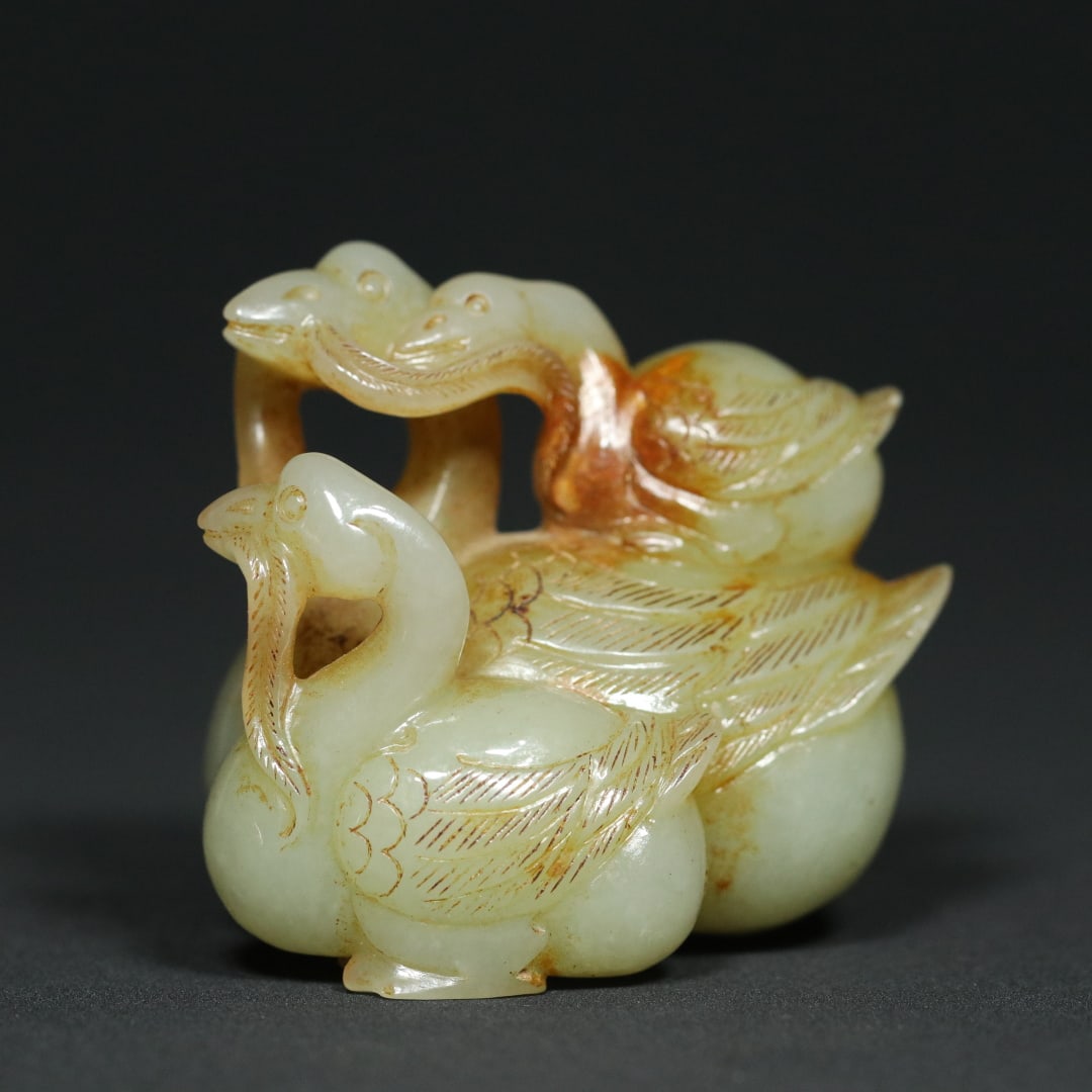 An Exquisite White Jade Goose Ornament: An Exquisite White Jade Goose Ornament Han Dynasty, China Size:2.2inx1.5inx2in Weight:117.3g白玉其乐融融鹅三只鹅摆件