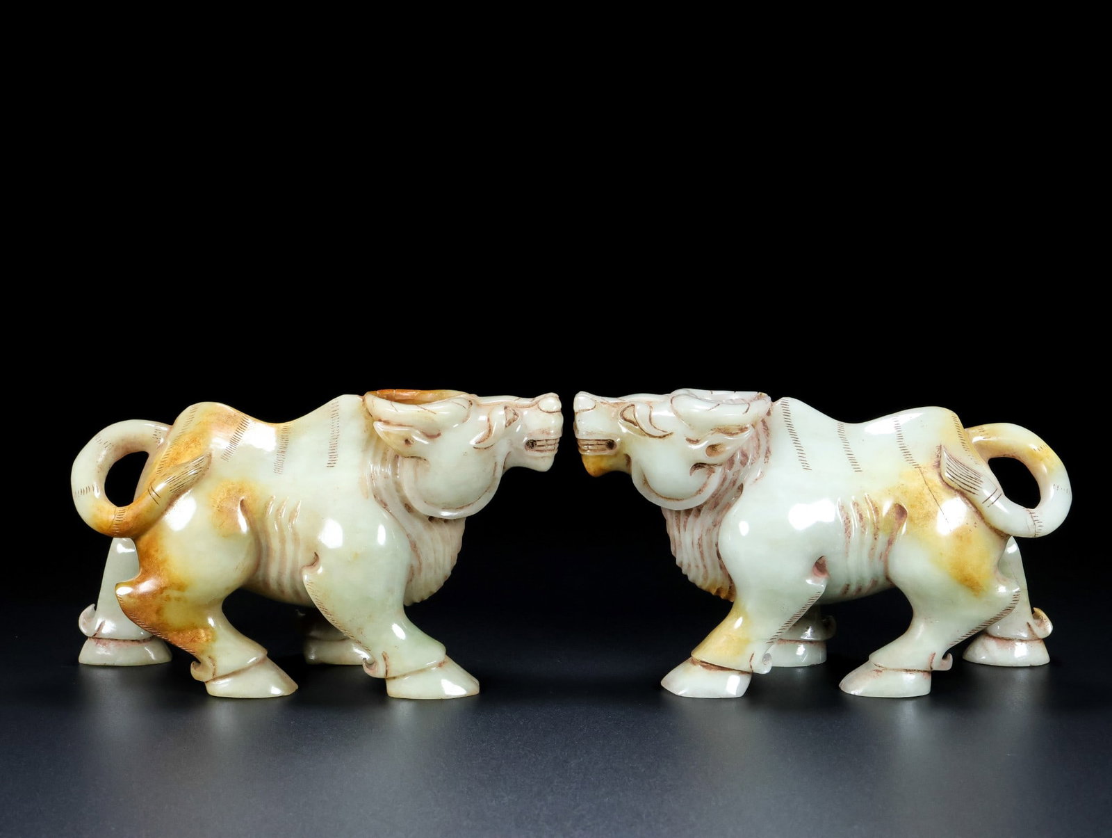 A Pair of Exquisite White Jade Buffalo Ornament: A Pair of Exquisite White Jade Buffalo Ornament Qing Dynasty, China Size:6.3inx3.9inx2.8in Total Weight:1642g白玉牛牛一对 中国清代