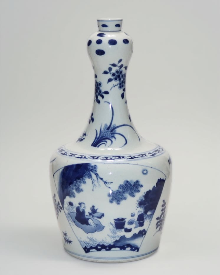 An Exquisite Blue and White Flower Pattern Character and Story Pattern Vase: An Exquisite Blue and White Flower Pattern Character and Story Pattern Vase Ming Dynasty, China Size:13.3in青花花卉开窗人物图蒜头ī