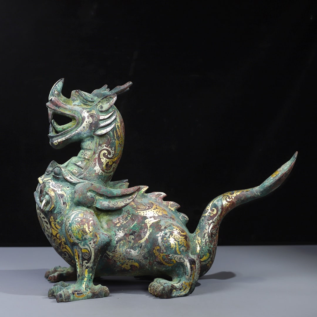 An Exquisite Bronze Inlaid Gold and Silver Auspicious Beast Ornament: An Exquisite Bronze Inlaid Gold and Silver Auspicious Beast Ornament Han Dynasty, China Size:11.4inx13.8in