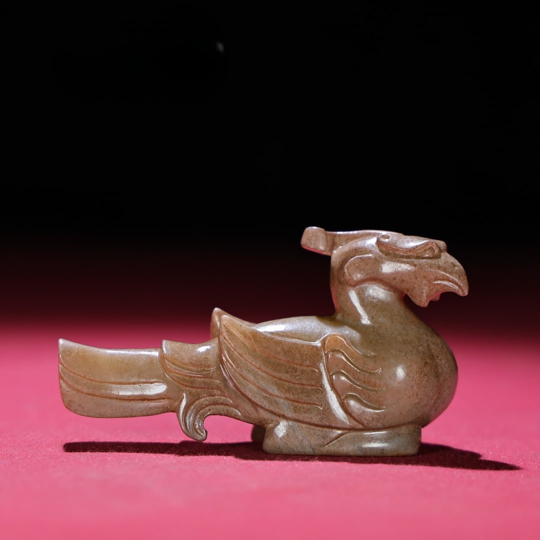 An Exquisite White Jade Phoenix Hand Piece: An Exquisite White Jade Phoenix Hand Piece Han Dynasty, China Size:2.9inx1inx1.5in Weight:67g白玉凤鸟把件 中国汉代 Size:7.4cmx2.6cmx3.9cm