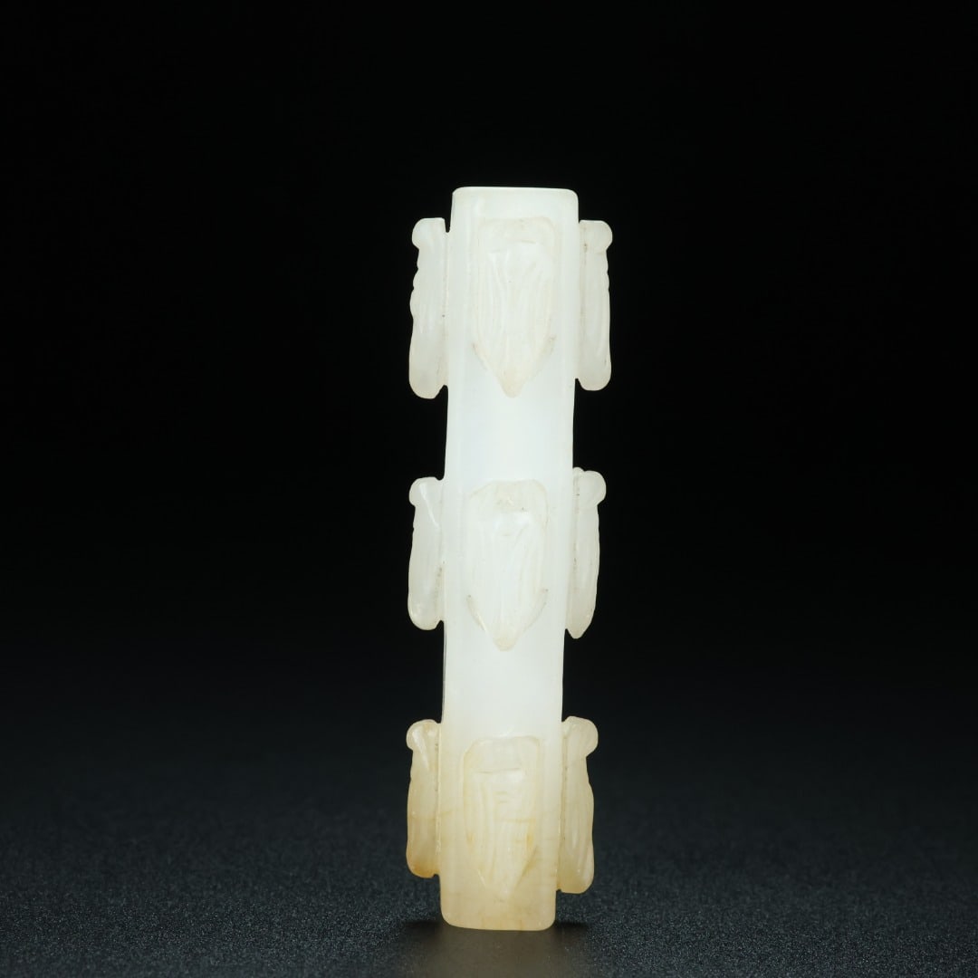 An Exquisite White Jade Ornament: An Exquisite White Jade Ornament Han Dynasty, China Size:2.8inx0.5inx0.5in Weight:31.7g白玉勒子 中国汉代 Size:7cmx1.3cmx1.3cm Weight:31.7g
