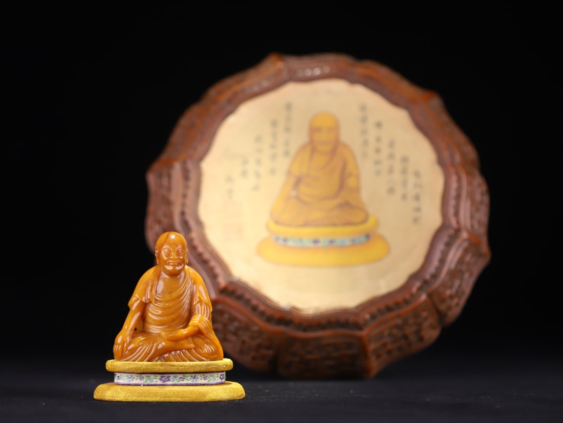 An Exquisite Tianhuang Stone Statue of Arhat: An Exquisite Tianhuang Stone Statue of Arhat Qing Dynasty, China Size:3.5inx3inx1.6in Weight:275.9g田黄罗汉像配黄花梨盖盒