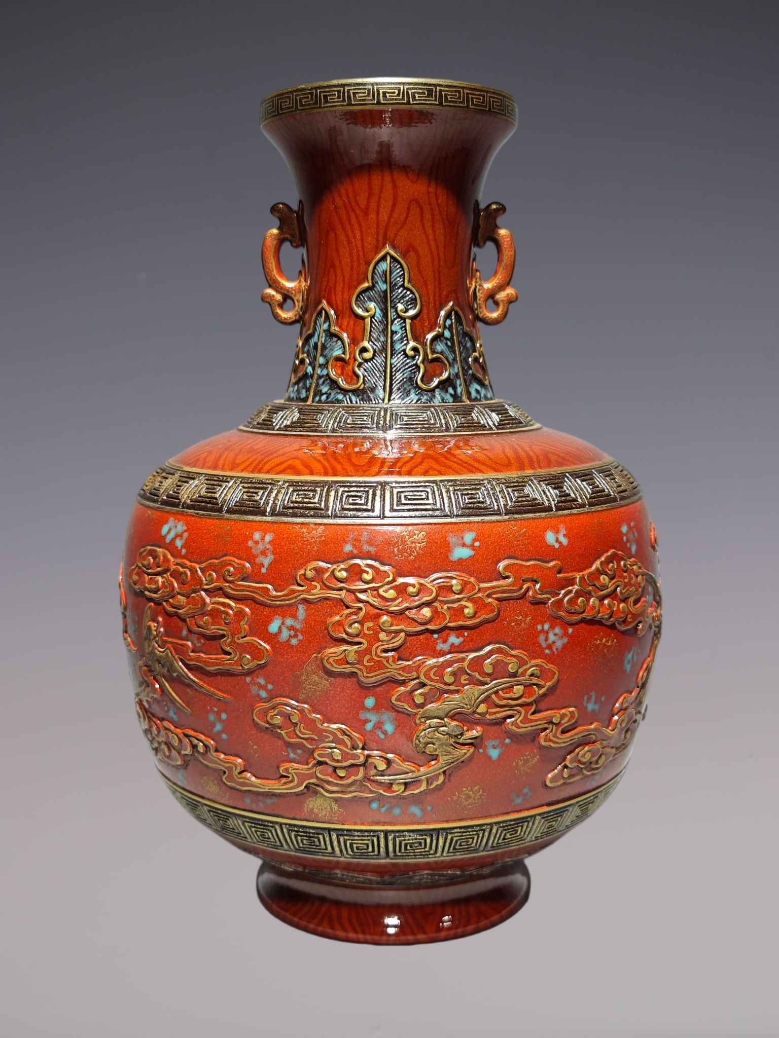 An Exquisite Iron-Red Auspicious Cloud Pattern Double-Ears Vase: An Exquisite Iron-Red Auspicious Cloud Pattern Double-Ears Vase Qing Dynasty, China Qianlong Six-character Mark