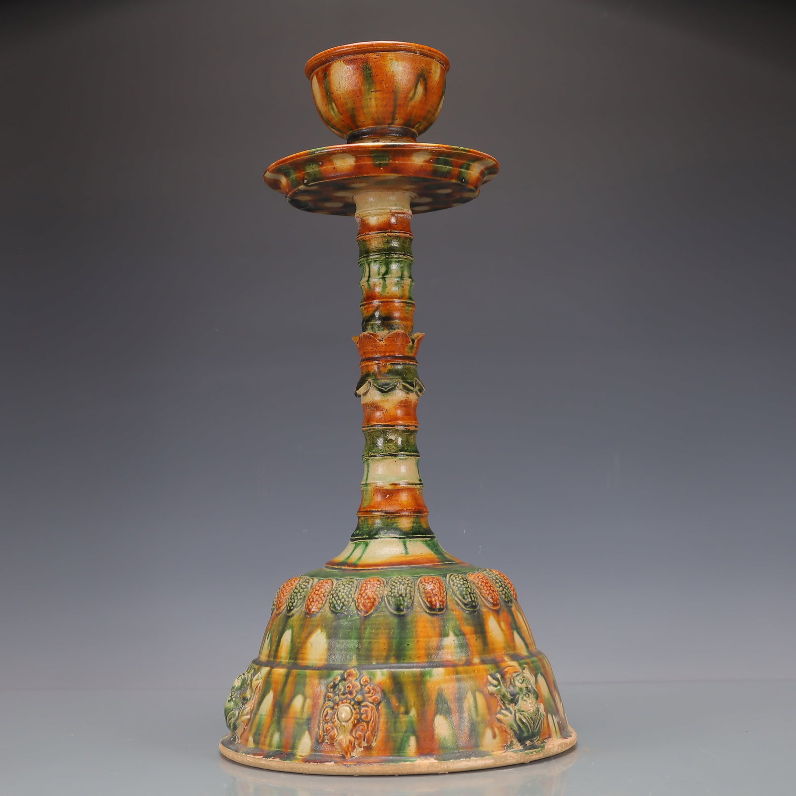 A Exquisite Trio-colored glazed pottery of the Tang Dynasty Flower Pattern Candlestick: A Exquisite Trio-colored glazed pottery of the Tang Dynasty Flower Pattern Candlestick Tang Dynasty, China Size:9.8inx9.8inx18.9in Weight:3000g唐三彩花卉纹烛&