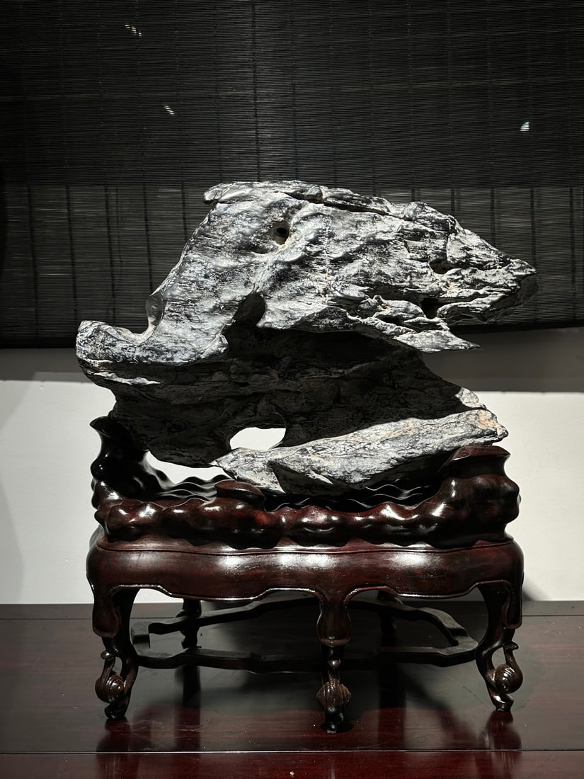 An Exquisite Lingbi Stone Ornament: An Exquisite Lingbi Stone Ornament Qing Dynasty, China Size:21.3inx18.9inx10.6in灵璧石横峰摆件 中国清代 Size:54cmx48cmx27cm