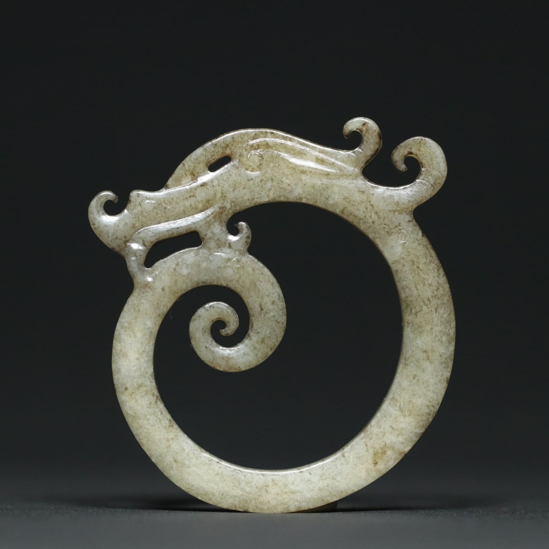An Exquisite White Jade Dragon Pendant: An Exquisite White Jade Dragon Pendant Han Dynasty, China Size:1.9inx1.8inx0.2in Weight:16.5g白玉玉龙挂件 中国汉代 Size:4.9cmx4.6cmx0.6cm