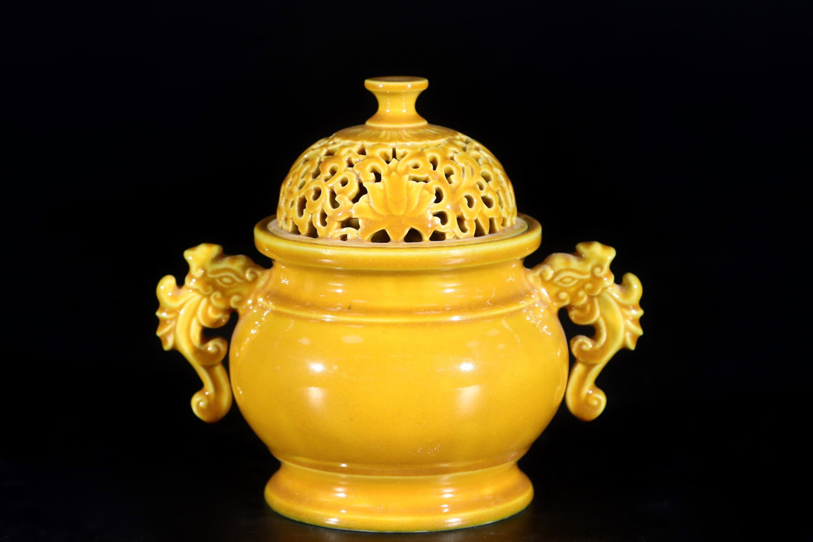 An Exquisite Yellow Glazed Double-Ears Censer: An Exquisite Yellow Glazed Double-Ears Censer Qing Dynasty, China Qianlong Six-character Mark Size:4.3inx3.4in黄釉雕刻镂空双龙耳香薰