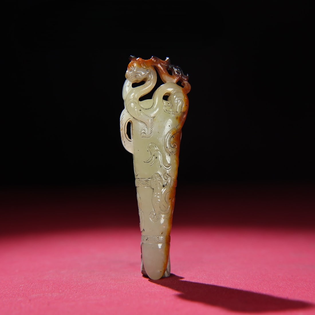 An Exquisite White Jade Chi-Dragon Pattern Pendant: An Exquisite White Jade Chi-Dragon Pattern Pendant Han Dynasty, China Size:3.7inx1.1inx0.6in Weight:51g白玉红沁龙挂饰 中国汉代 Size:9.