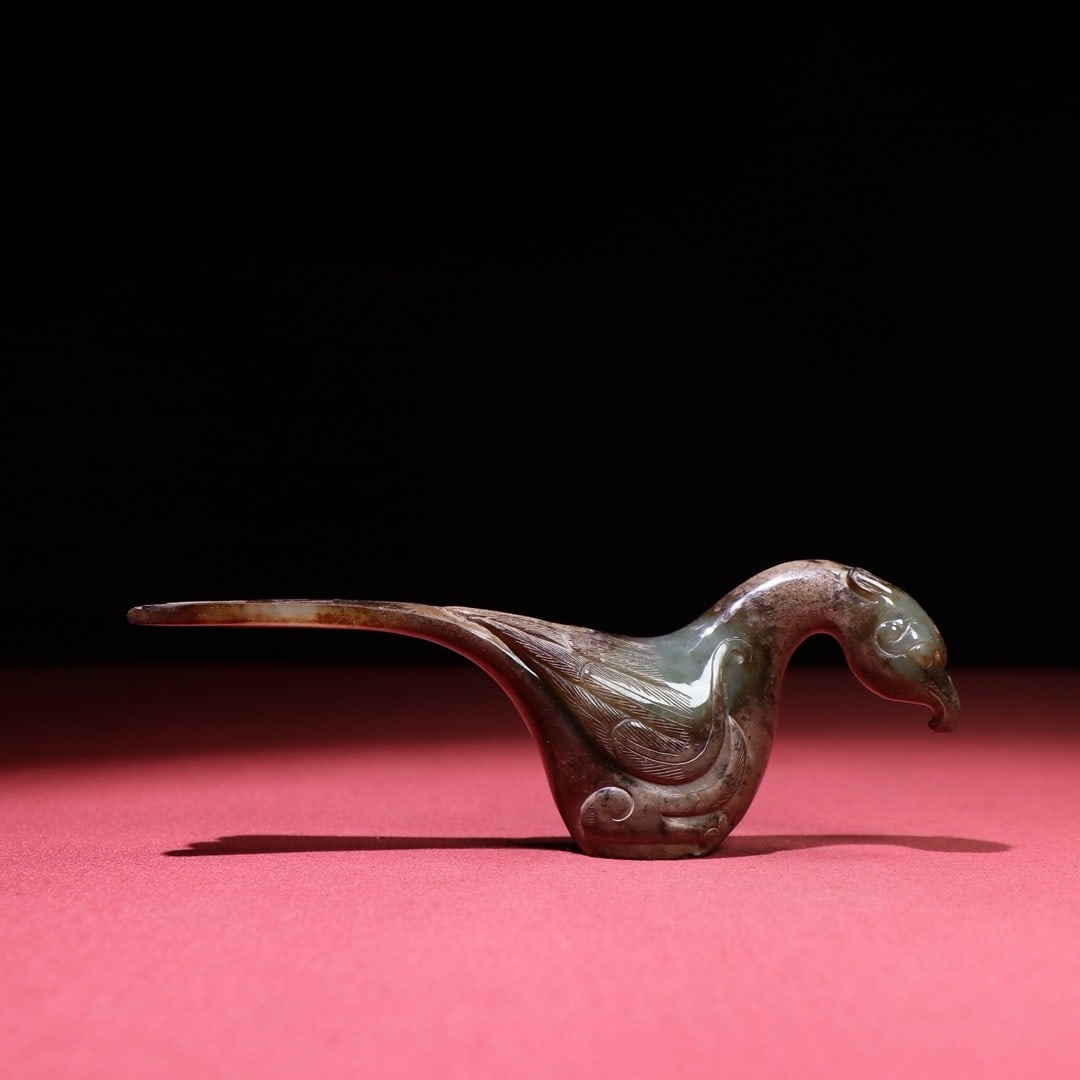 An Exquisite White Jade Phoenix Ornament: An Exquisite White Jade Phoenix Ornament Han Dynasty, China Size:6.1inx1.1inx1.6in Weight:150g白玉凤鸟权杖首 中国汉代