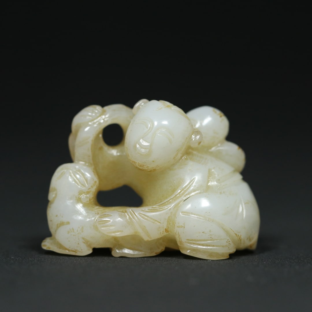 An Exquisite White Jade Figure Pendant: An Exquisite White Jade Figure Pendant Qing Dynasty, China Size:1.5inx0.7inx1.1in Weight:20.6g白玉童子戏兽童子献寿挂件 中&
