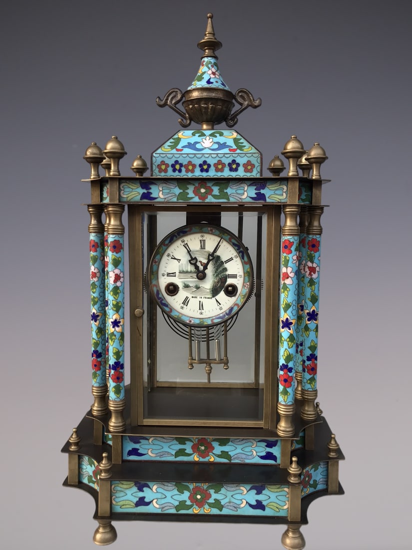 An Exquisite Bronze Lotus Pattern Clock: An Exquisite Bronze Lotus Pattern Clock Qing Dynasty, China Size:13.8inx9.1inx22in铜缠枝莲纹钟表 中国清代 Size:35cmx23cmx56cm
