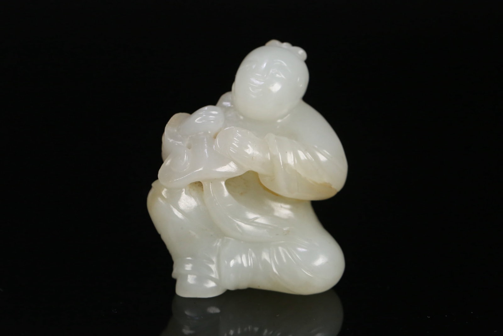 An Exquisite White Jade Figure Ornament: An Exquisite White Jade Figure Ornament Qing Dynasty, China Size:2inx1.7inx1.1in Weight:71.3g白玉童子雕件 中国清代 Size:5cmx4.3cmx2.7cm
