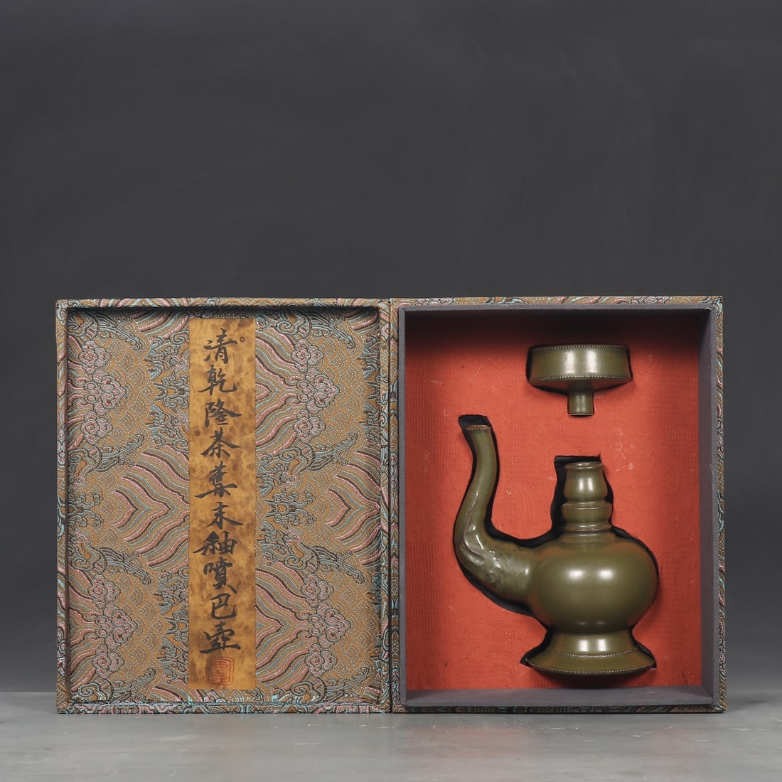 An Exquisite Teadust Glazed Ewer: An Exquisite Teadust Glazed Ewer Qing Dynasty, China Qianlng Six-character Mark Size:7.4inx3.9in茶叶末釉喷巴壶 中国清代
