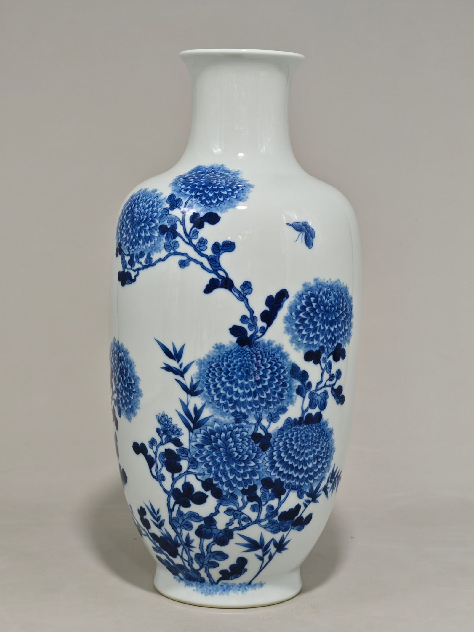 A Rare Blue and White Chrysanthemum Butterfly Pattern Vase: A Rare Blue and White Chrysanthemum Butterfly Pattern Vase,Qing Dynasty,China,Yongzheng Six-character Mark,Size:13.6inx6.7in 青花菊花蝴蝶纹瓶,中&#