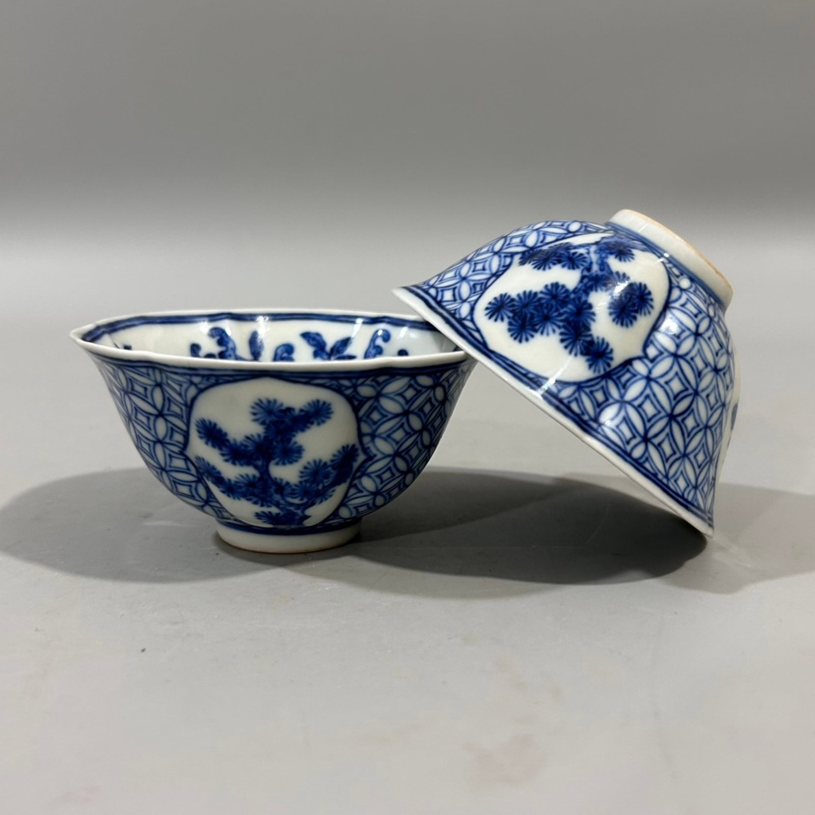 A Pair of Exquisite Blue and White Pine,Bamboo and Plum Blossom Pattern Cups: A Pair of Exquisite Blue and White Pine,Bamboo and Plum Blossom Pattern Cups,Qing Dynasty,China,Yongzheng Six-character Mark,Size:3.5inx1.8in 一对青花松竹梅&#