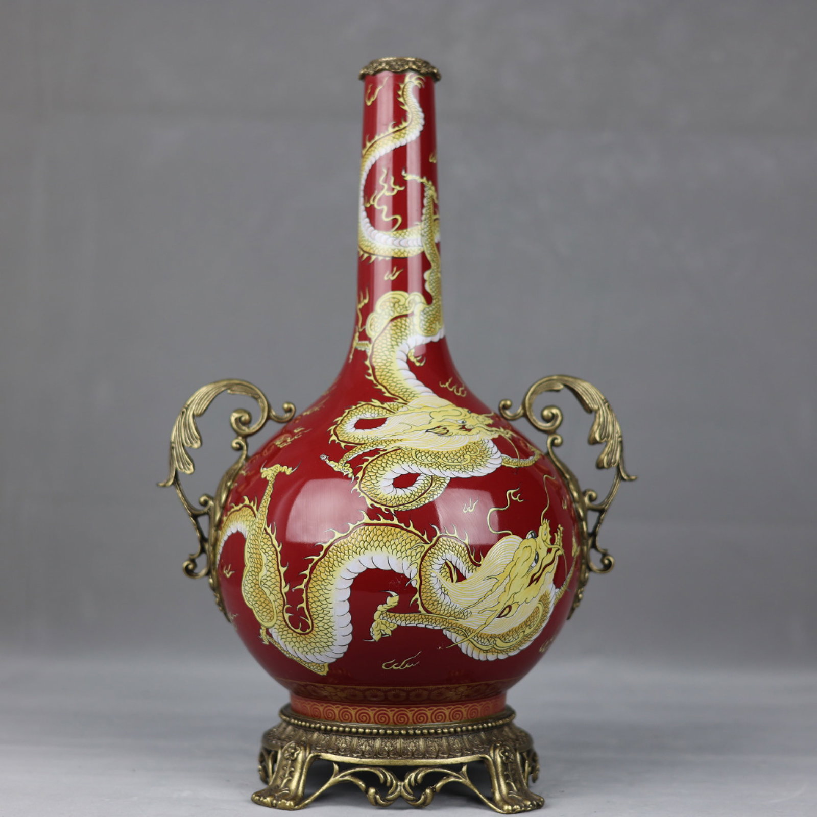 A Huge Famille-Rose Red Ground Inlaid Bronze Painted Gold Dragon Pattern Double-Ears Vase: A Huge Famille-Rose Red Ground Inlaid Bronze Painted Gold Dragon Pattern Double-Ears Vase,Qing Dynasty,China,Qianlong Four-character Mark,Size:17.3inx2inx10.6inx6.3in 粉彩红地&