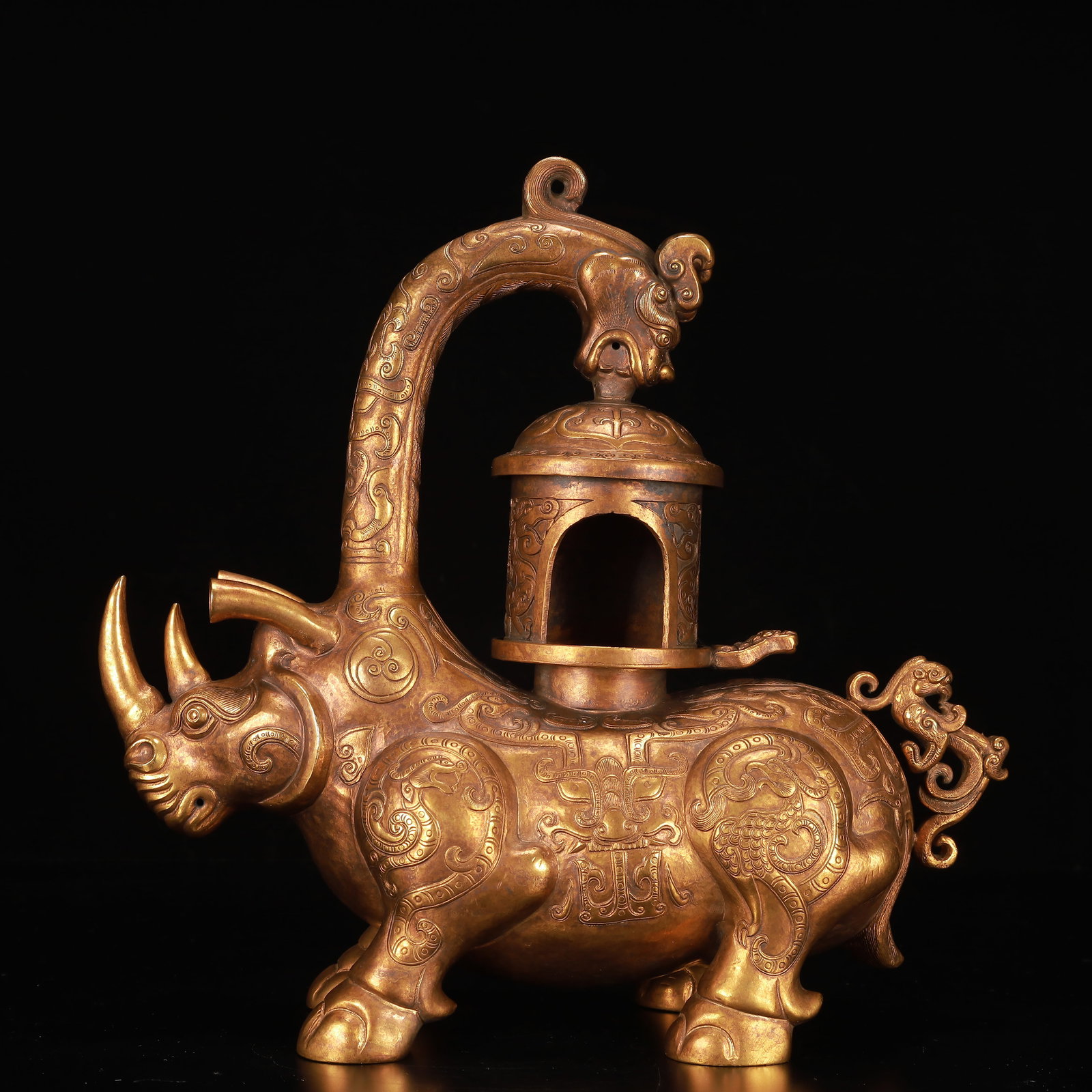 A Rare Gilt Bronze Beast-Face Pattern Rhinoceros-Shaped Palace Lantern: A Rare Gilt Bronze Beast-Face Pattern Rhinoceros-Shaped Palace Lantern,Qing Dynasty, China,Size:12.2inx4.7inx11.8in,Weight:2650g 铜鎏金兽面纹犀牛形