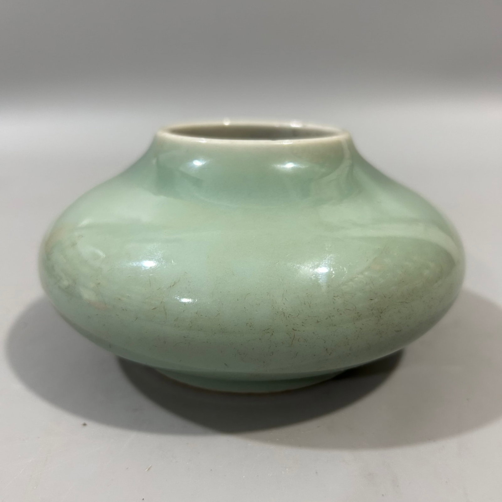 An Exquisite Celadon Glazed Water Pot: An Exquisite Celadon Glazed Water Pot,Qing Dynasty,China,Kangxi Six-character Mark,Size:3inx4.3in 青釉水盂,中国清代,康熙六字