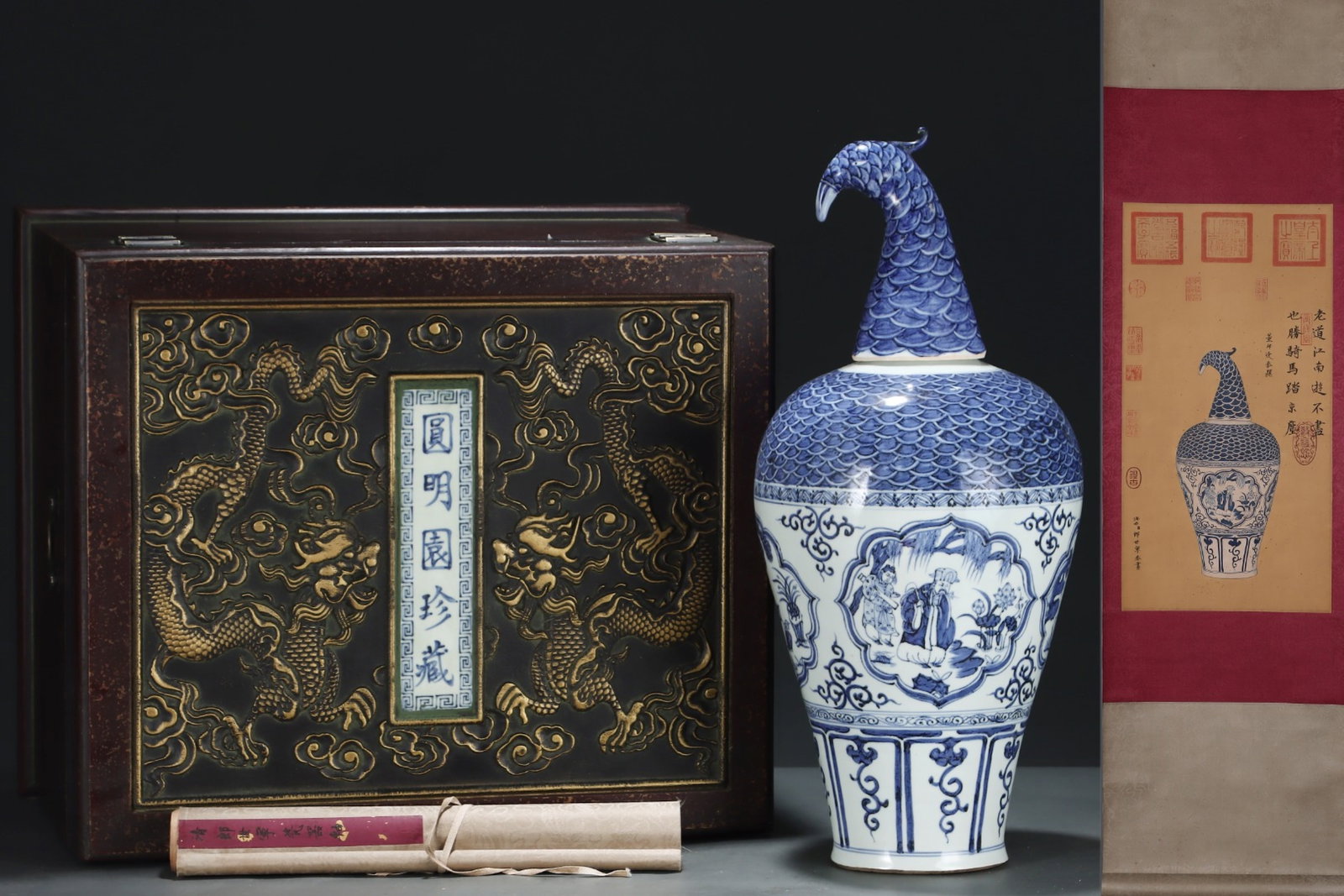 A Huge Blue and White Seawater Figure Pattern Vase,With Phoenix-head Cover,With Vertical Scroll: A Huge Blue and White Seawater Figure Pattern Vase,With Phoenix-head Cover,With Vertical Scroll Painting on Silk,Yuan Dynasty, China,Size:22.4inx10in,(Without frame)24.4inx12.6in