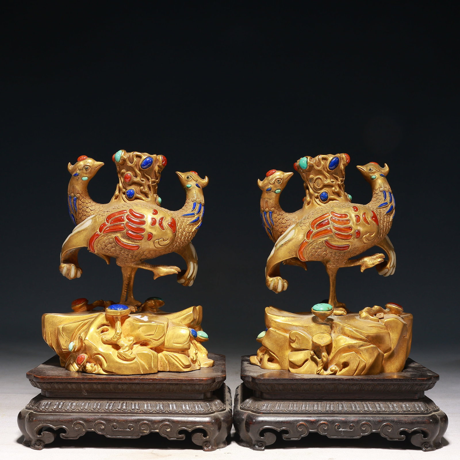 A Pair of Exquisite Gilt Bronze Phoenix Ornaments,Inlaid Gems,With Base: A Pair of Exquisite Gilt Bronze Phoenix Ornaments,Inlaid Gems,With Base,Qing Dynasty, China,Qianlong Four-character Mark,Size:6.3inx5.1inx9.8in,Weight:7450g