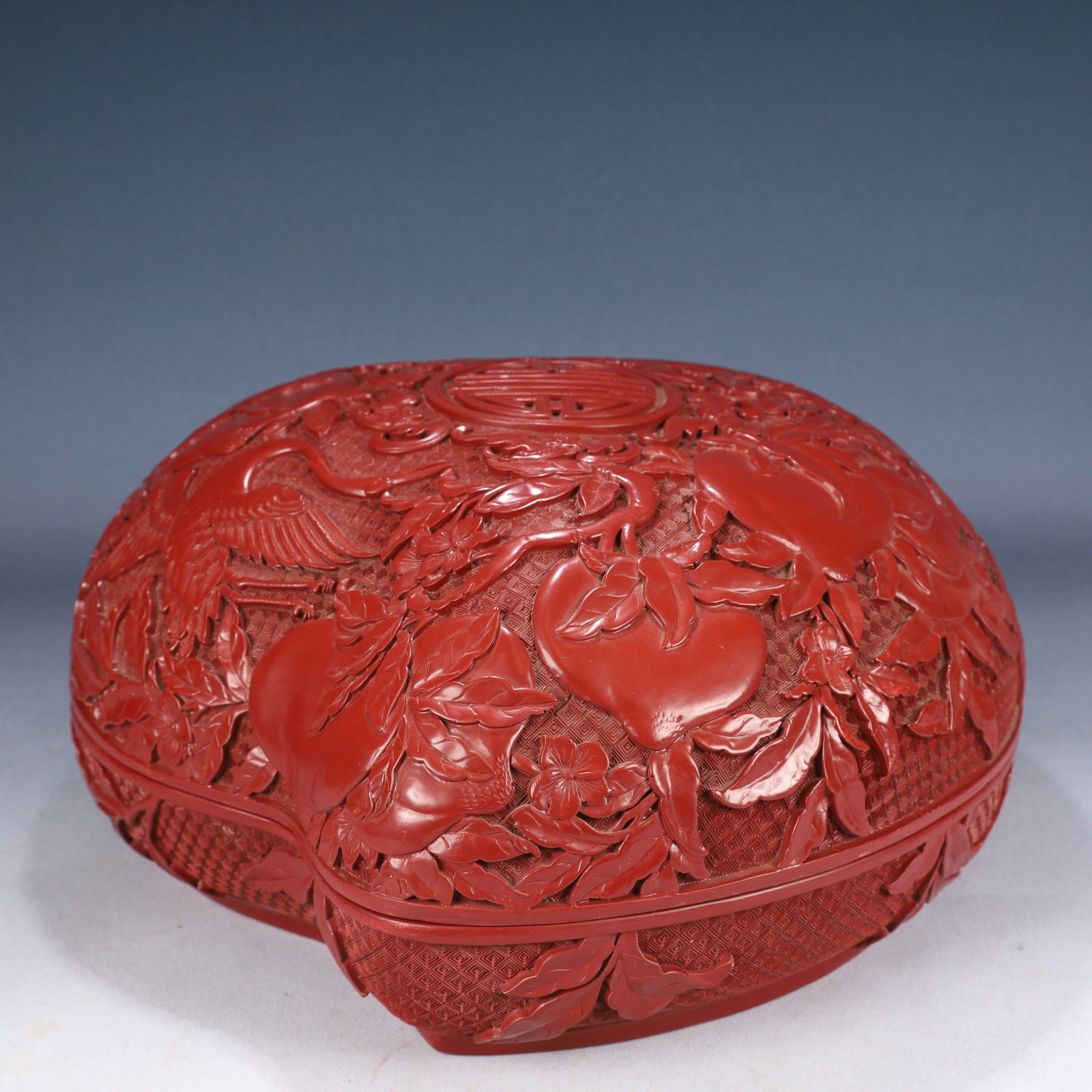 A Huge Carved Red Lacquer Bats and Peach Pattern Peach-Shaped Cover Box: A Huge Carved Red Lacquer Bats and Peach Pattern Peach-Shaped Cover Box,Qing Dynasty, China,Qianlong Six-character Mark,Size:15inx15.7inx7.9in,Weight:3850g 剔红漆福寿 