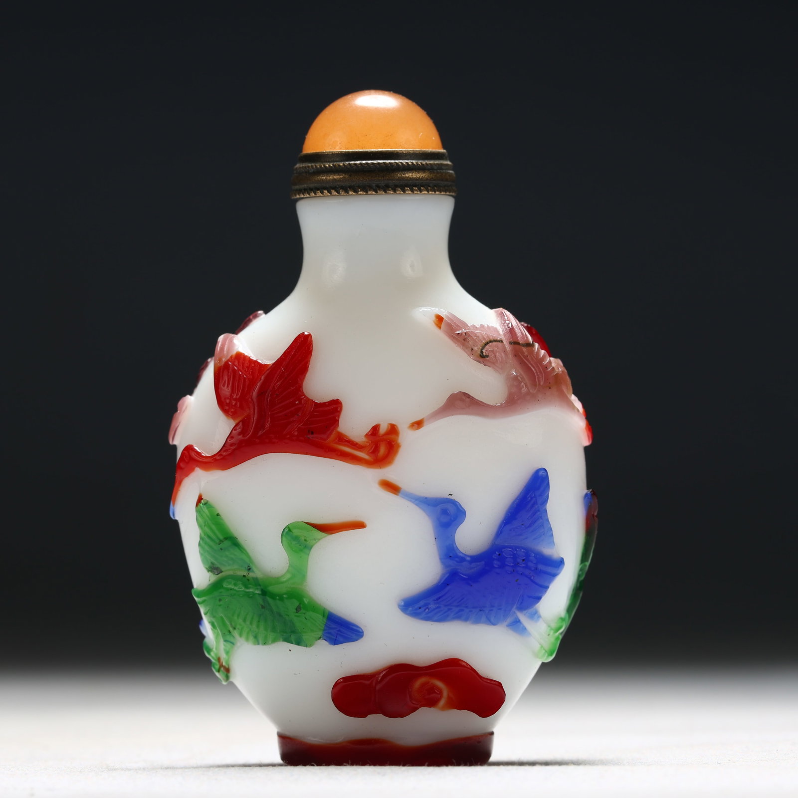 An Exquisite Glass Multi-Color Overlay Auspicious Cloud and Crane Pattern Snuff Bottle: An Exquisite Glass Multi-Color Overlay Auspicious Cloud and Crane Pattern Snuff Bottle,Qing Dynasty, China,Qianlong Four-character Mark,Size:1.7inx0.8inx2.6in 琉璃套彩祥&