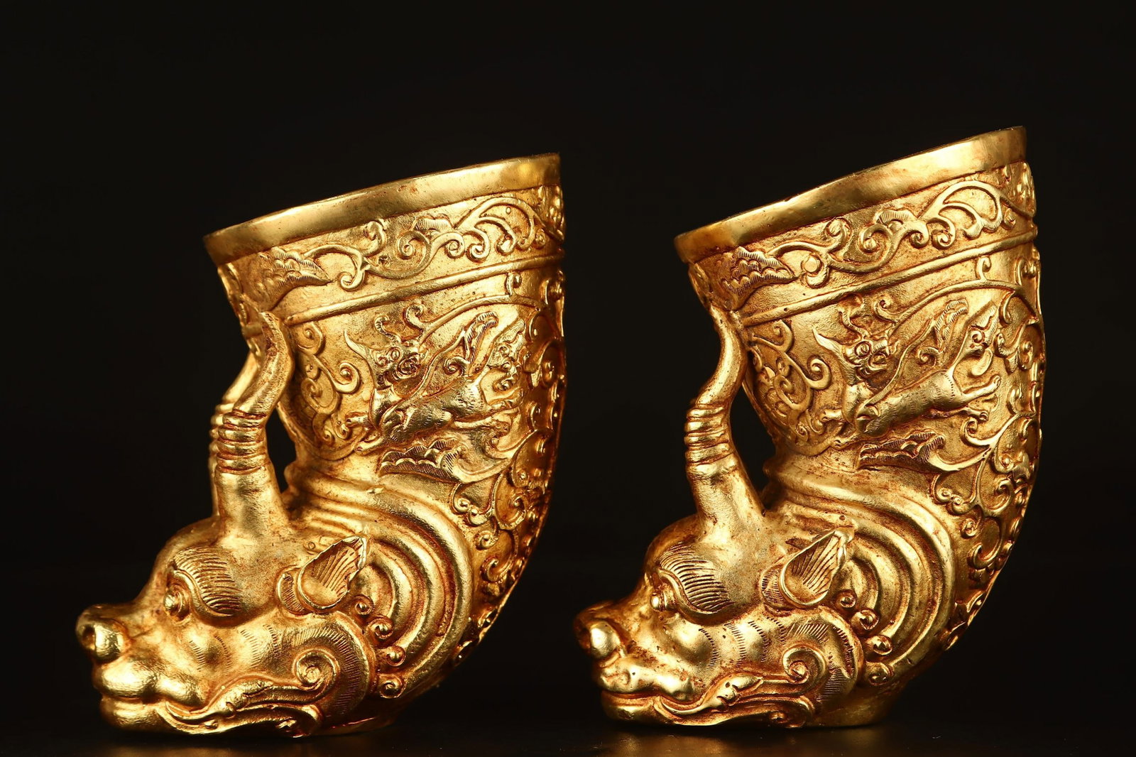 A Pair of Exquisite Gilt Bronze Auspicious Beast Pattern Beast-Shaped Cups: A Pair of Exquisite Gilt Bronze Auspicious Beast Pattern Beast-Shaped Cups,Qing Dynasty,China,Qianlong Four-character Mark,Size:4.1inx4.3in,Total Weight:1706g 一对铜鎏金&