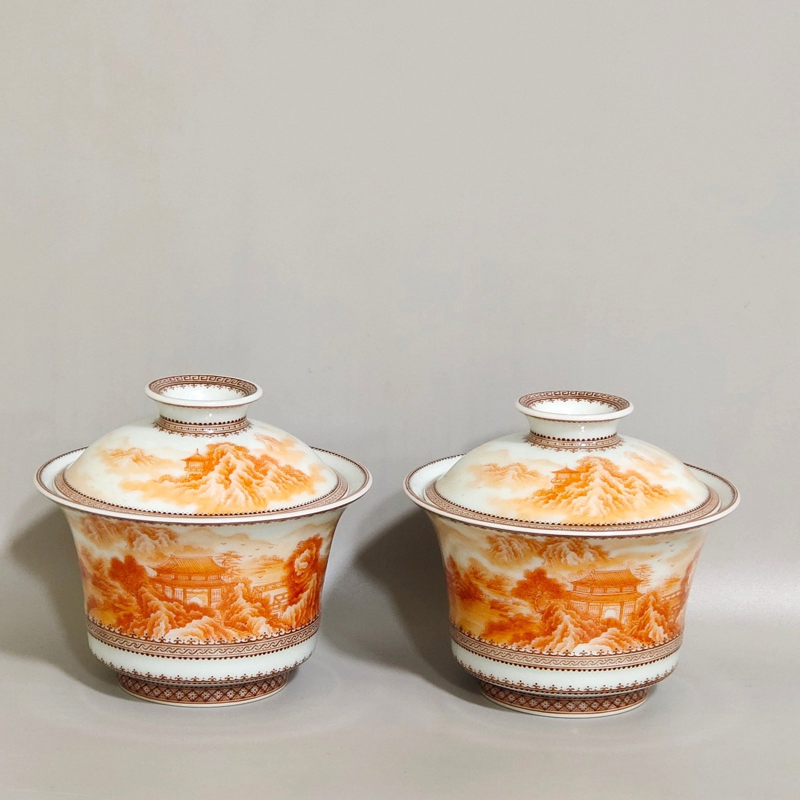 A Pair of Exquisite Enamel Iron-Red Landscape Pattern Cover Bowls: A Pair of Exquisite Enamel Iron-Red Landscape Pattern Cover Bowls,Qing Dynasty,China,Qianlong Four-character Mark,Size:3.1inx3.2in