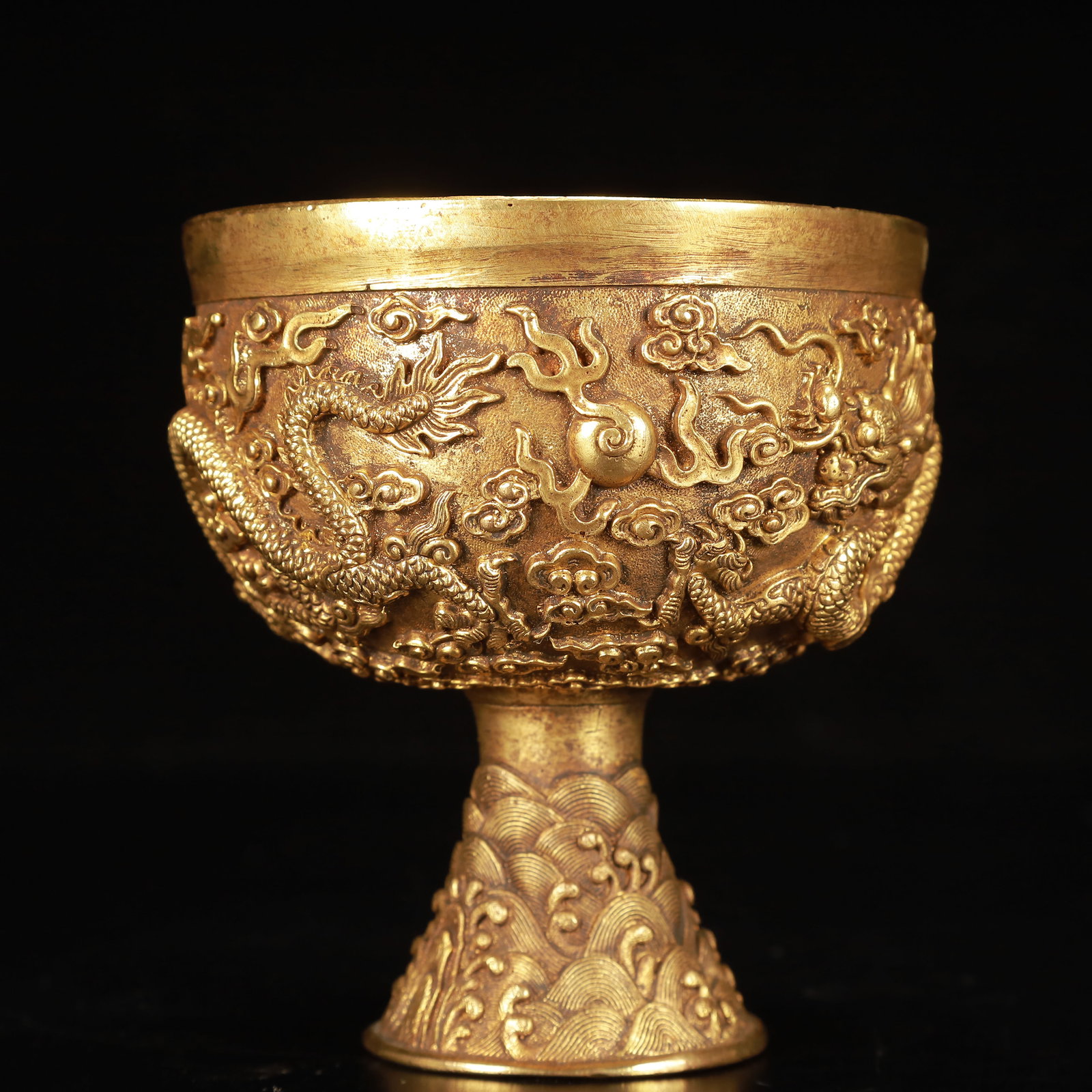 An Exquisite Gilt Bronze Auspicious Cloud and Dragon Pattern Stem Cup: An Exquisite Gilt Bronze Auspicious Cloud and Dragon Pattern Stem Cup,Qing Dynasty, China,Size:3.9inx4.5in,Weight:800g 铜鎏金祥云龙纹高足杯,
