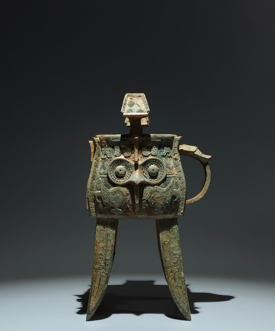 An Archaic Bronze Beast-Face Pattern four legs Cup: An Archaic Bronze Beast-Face Pattern four legs Cup,W.Zhou,China,Size:13.4inx7.9inx5.9in 青铜兽面纹四足杯,中国西周时期