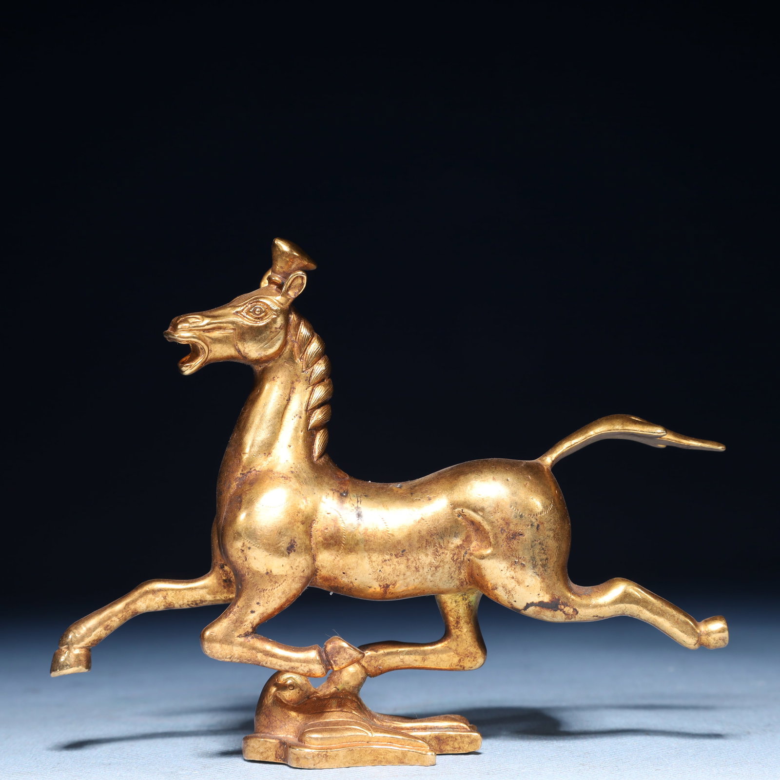 An Exquisite Gilt Bronze Horse Ornament: An Exquisite Gilt Bronze Horse Ornament,Qing Dynasty,China,Size:5.1inx3.9inx1.2in,Weight:500g 铜鎏金骏马摆件,中国清代