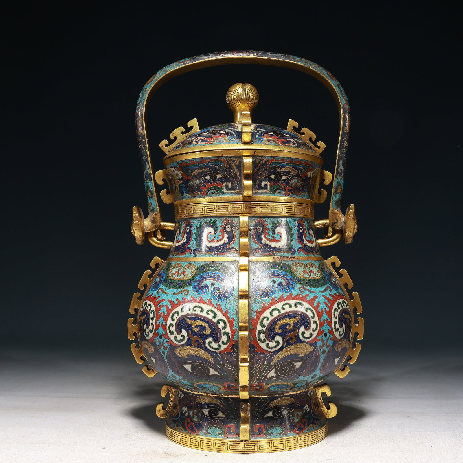 A Rare Cloisonne Beast-Face Pattern Beast-Ears Ewer: A Rare Cloisonne Beast-Face Pattern Beast-Ears Ewer,Qing Dynasty, China,Size:8.7inx7.9inx14.6in,Weight:4750g 景泰蓝兽面纹兽耳提壶,中&#