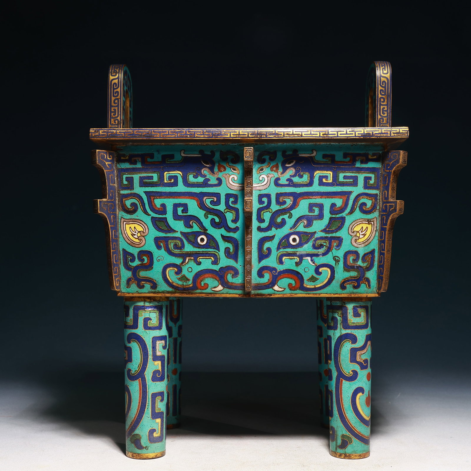 A Rare Cloisonne Beast-Face Pattern Double-Ears Four Legs Censer: A Rare Cloisonne Beast-Face Pattern Double-Ears Four Legs Censer,Qing Dynasty,China,Size:11.4inx8.7inx14.8in,Weight:5600g 景泰蓝兽面纹双耳四ห