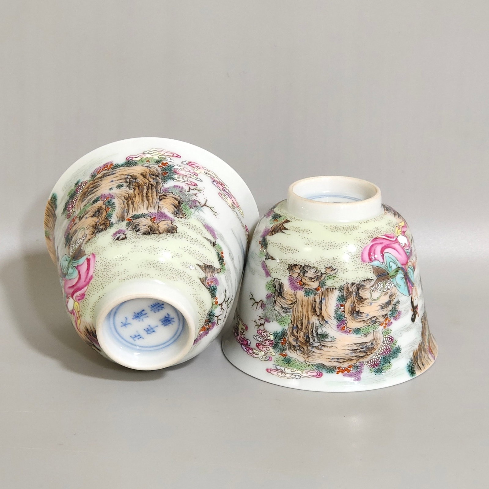 A Pair of Exquisite Famille-Rose Landscape and Figure Pattern Cups: A Pair of Exquisite Famille-Rose Landscape and Figure Pattern Cups,Qing Dynasty,China,Yongzheng Six-character Mark,Size:2inx2.6in 一对粉彩山水人物ಬ