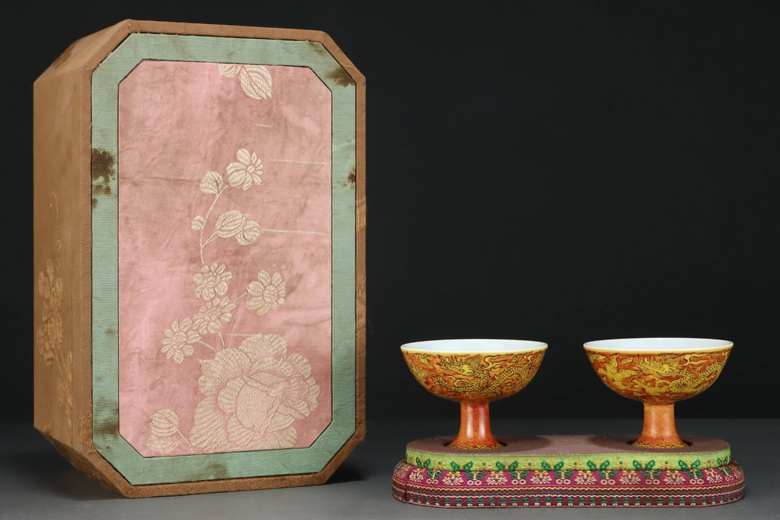 A Pair of Exquisite Red Ground Yellow Glazed Auspicious Cloud and Dragon Pattern Stem Cups: A Pair of Exquisite Red Ground Yellow Glazed Auspicious Cloud and Dragon Pattern Stem Cups,Ming Dynasty,China,Jiajing Six-character Mark,Size:2.6inx3.5in 一对红地黄ດ