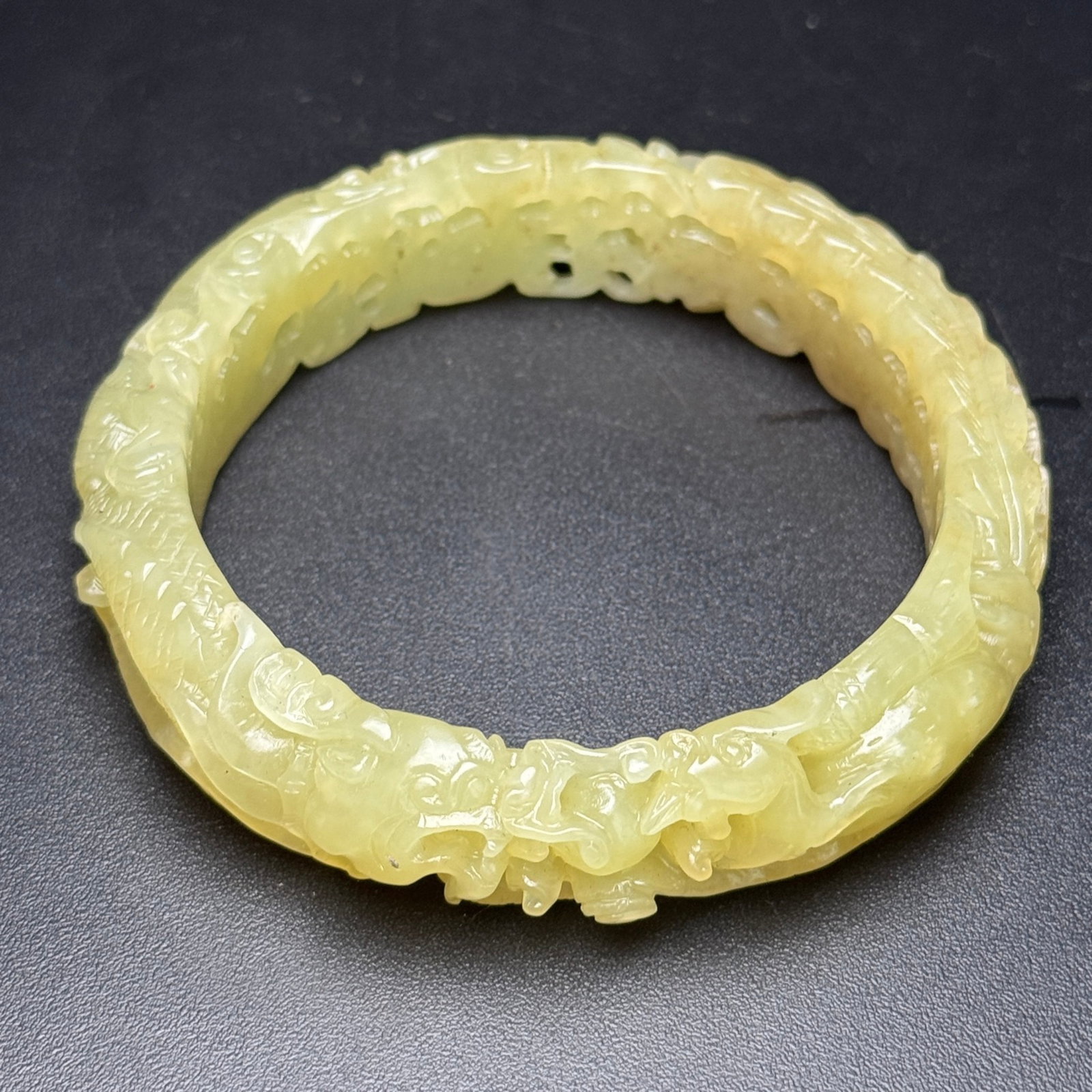 An Exquisite Yellow Jade Hollow Dragon and Phoenix Pattern Bracelets: An Exquisite Yellow Jade Hollow Dragon and Phoenix Pattern Bracelets,Qing Dynasty,China,Size:62mmx81mmx17mm,Weight:66g 黄玉镂空龙凤纹手镯,中