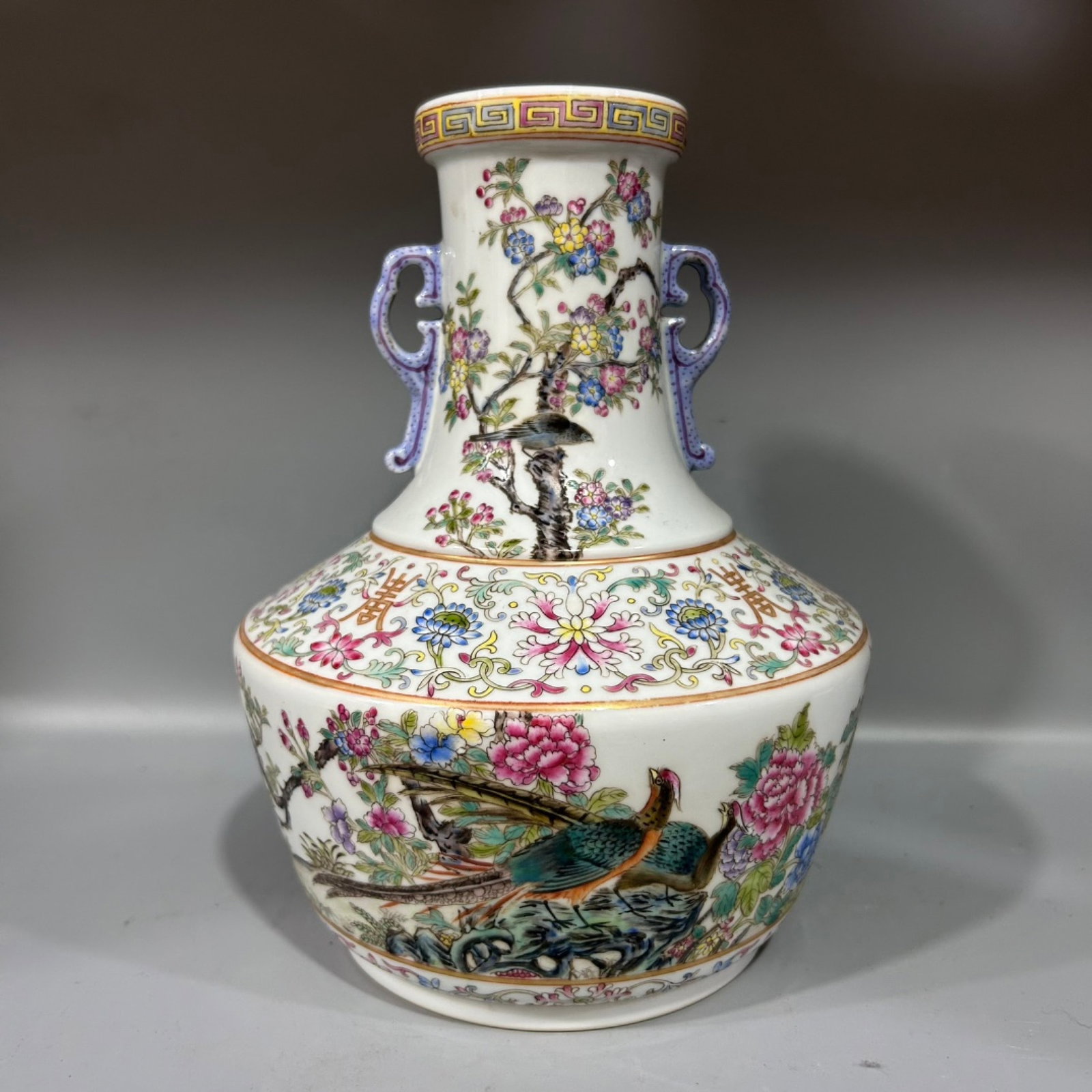 An Exquisite Famille-Rose Flower and Bird Pattern Double-Ears Vase: An Exquisite Famille-Rose Flower and Bird Pattern Double-Ears Vase,Qing Dynasty,China,Qianlong Six-character Mark,Size:6.5inx9.8in 粉彩花鸟纹双耳瓶,