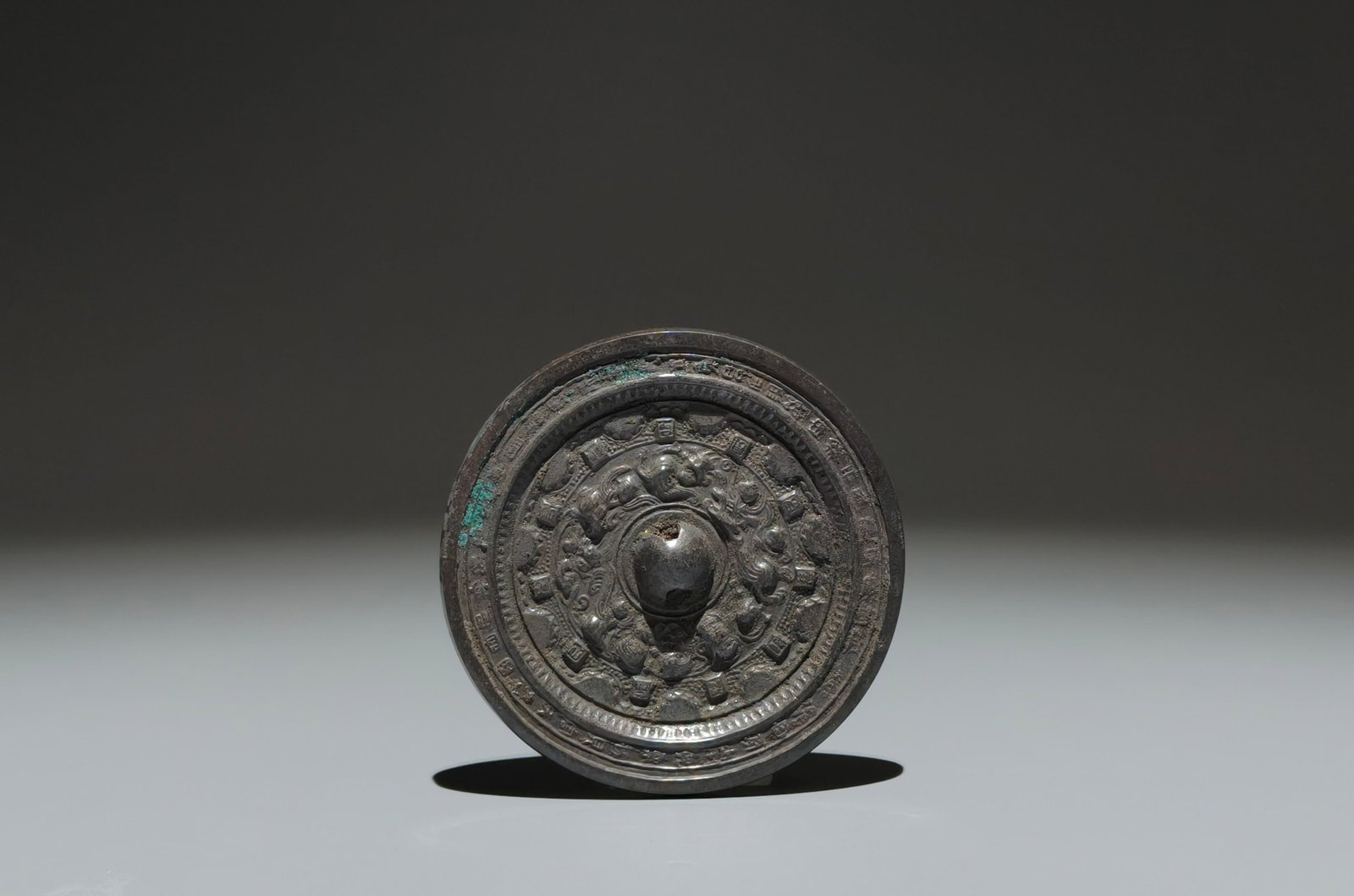 An Archaic Bronze Auspicious Beast Pattern Mirror: An Archaic Bronze Auspicious Beast Pattern Mirror,Han Dynasty,China,Size:3.3in 青铜瑞兽纹镜子,中国汉代