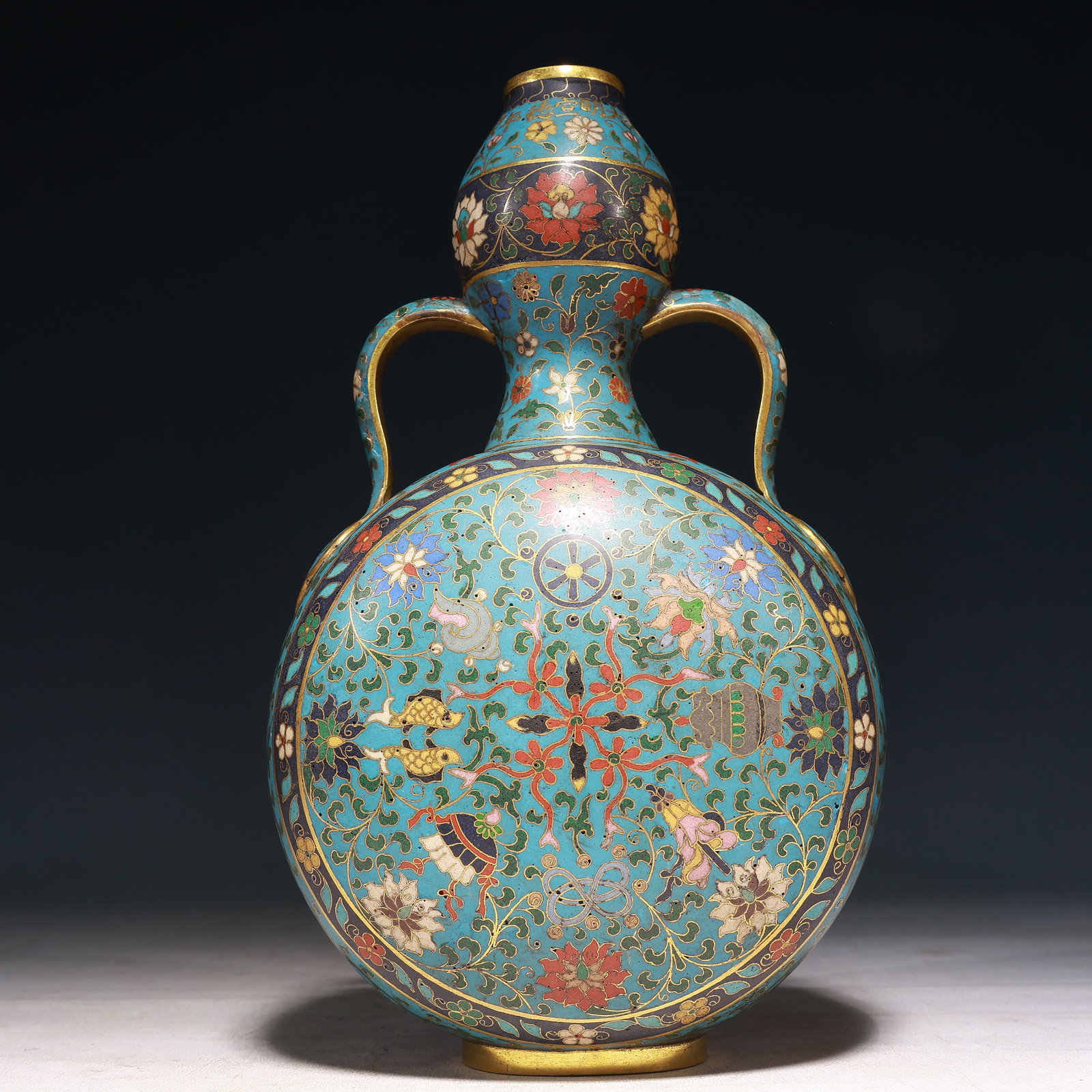 A Rare Cloisonne Lotus and Eight Treasures Pattern Double-Ears Vase: A Rare Cloisonne Lotus and Eight Treasures Pattern Double-Ears Vase,Qing Dynasty, China,Size:6.7inx4.5inx11.8in,Weight:1900g 景泰蓝缠枝莲八宝纹
