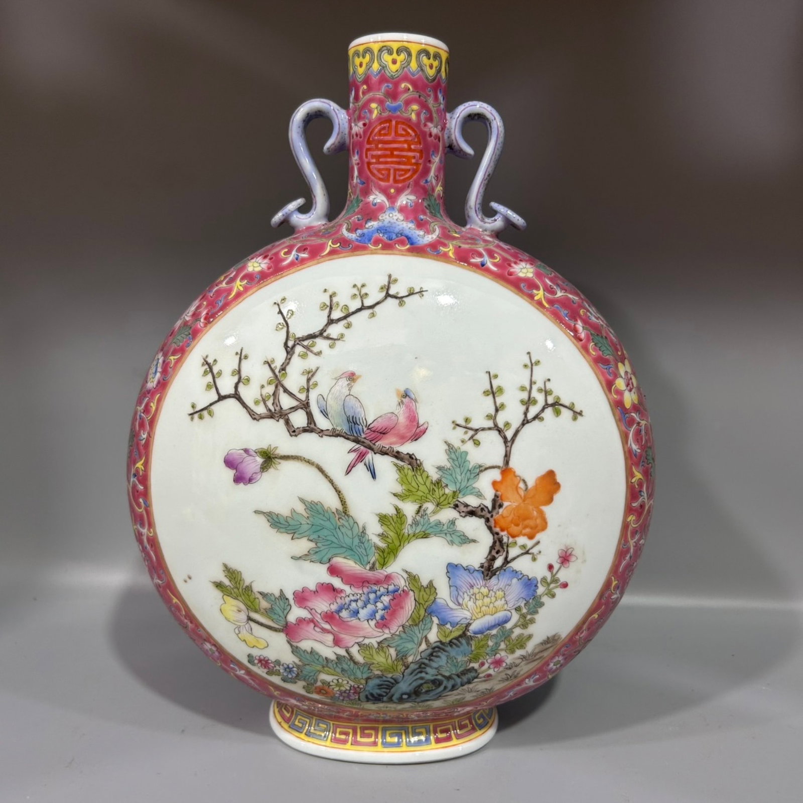 A Rare Ruby Red-Ground Famille-Rose Flower and Bird Pattern Ruyi-Ears Vase: A Rare Ruby Red-Ground Famille-Rose Flower and Bird Pattern Ruyi-Ears Vase,Qing Dynasty,China,Qianlong Six-character Mark,Size:8.3inx12.6in 胭脂红地粉彩花(