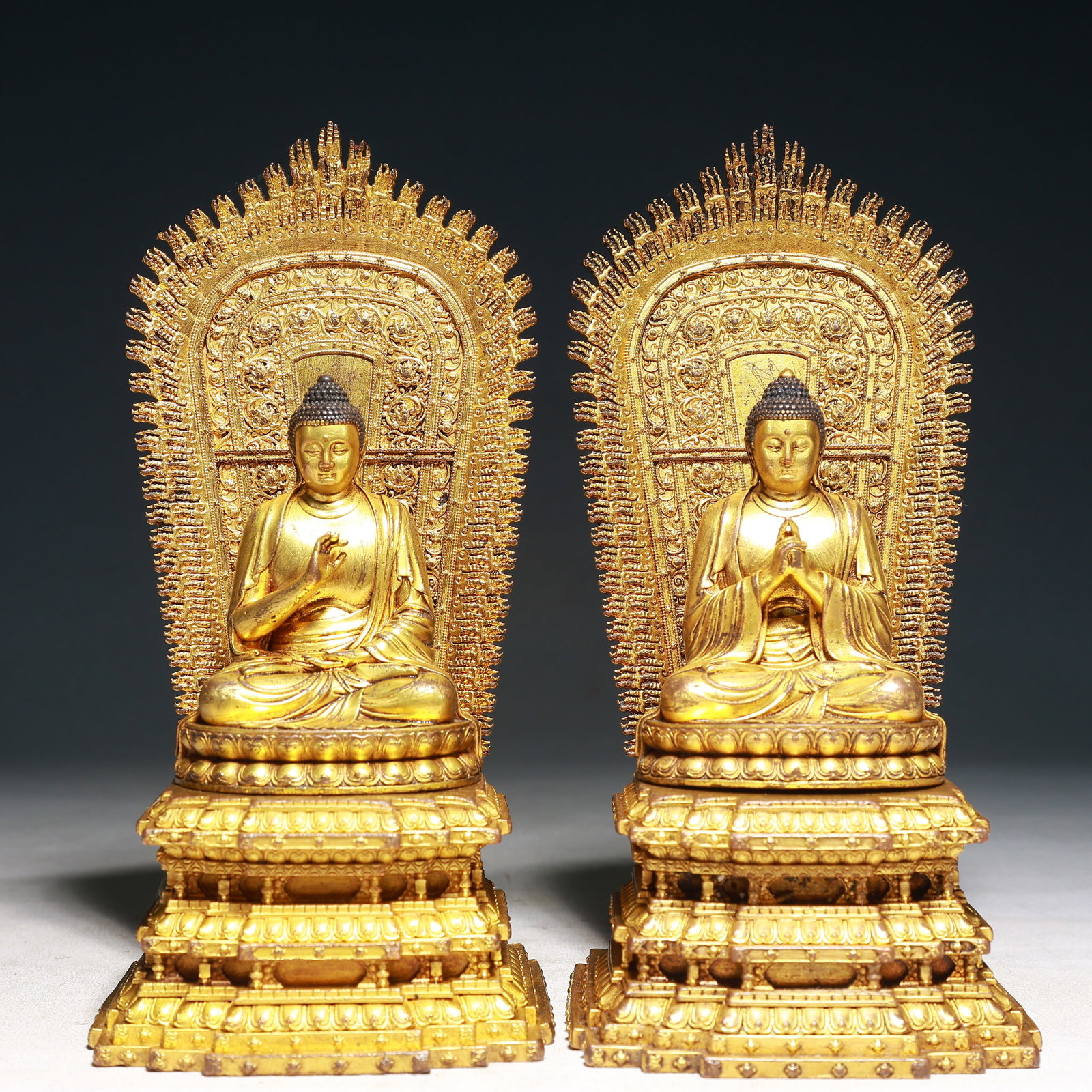 A Pair of Solemn Gilt Bronze Statue of Sakyamuni,With Inscription: A Pair of Solemn Gilt Bronze Statue of Sakyamuni,With Inscription,Qing Dynasty,China,Size:4.3inx3.9inx9.1in,Weight:3350g 一对铜鎏金如来像,带໤
