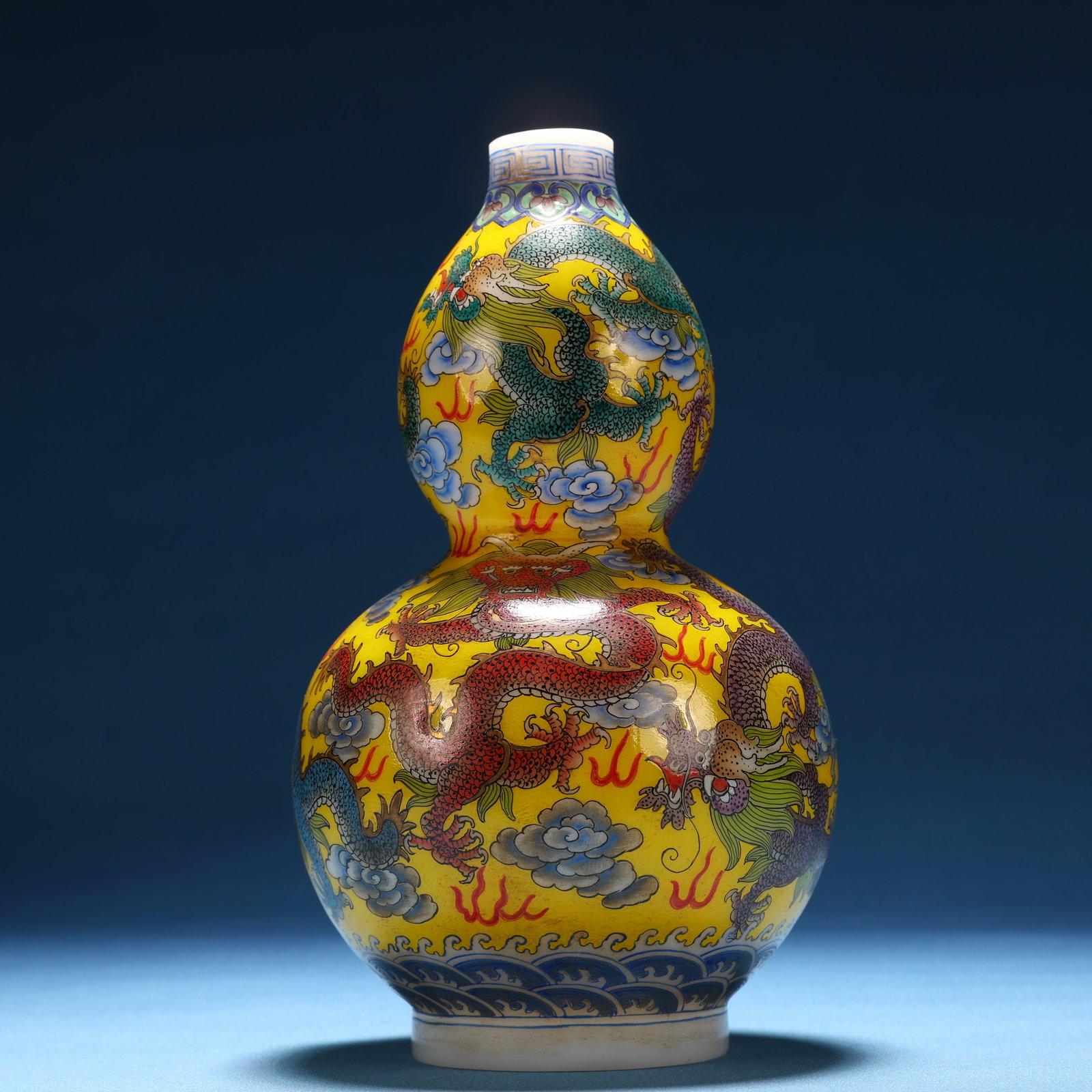 A Fine Glass Painted Enamel Auspicious Cloud and Dragon Pattern Gourd-Shaped Vase: A Fine Glass Painted Enamel Auspicious Cloud and Dragon Pattern Gourd-Shaped Vase,Qing Dynasty, China,Qianlong Four-character Mark,Size:3.9inx6.9in 料器画珐琅祥