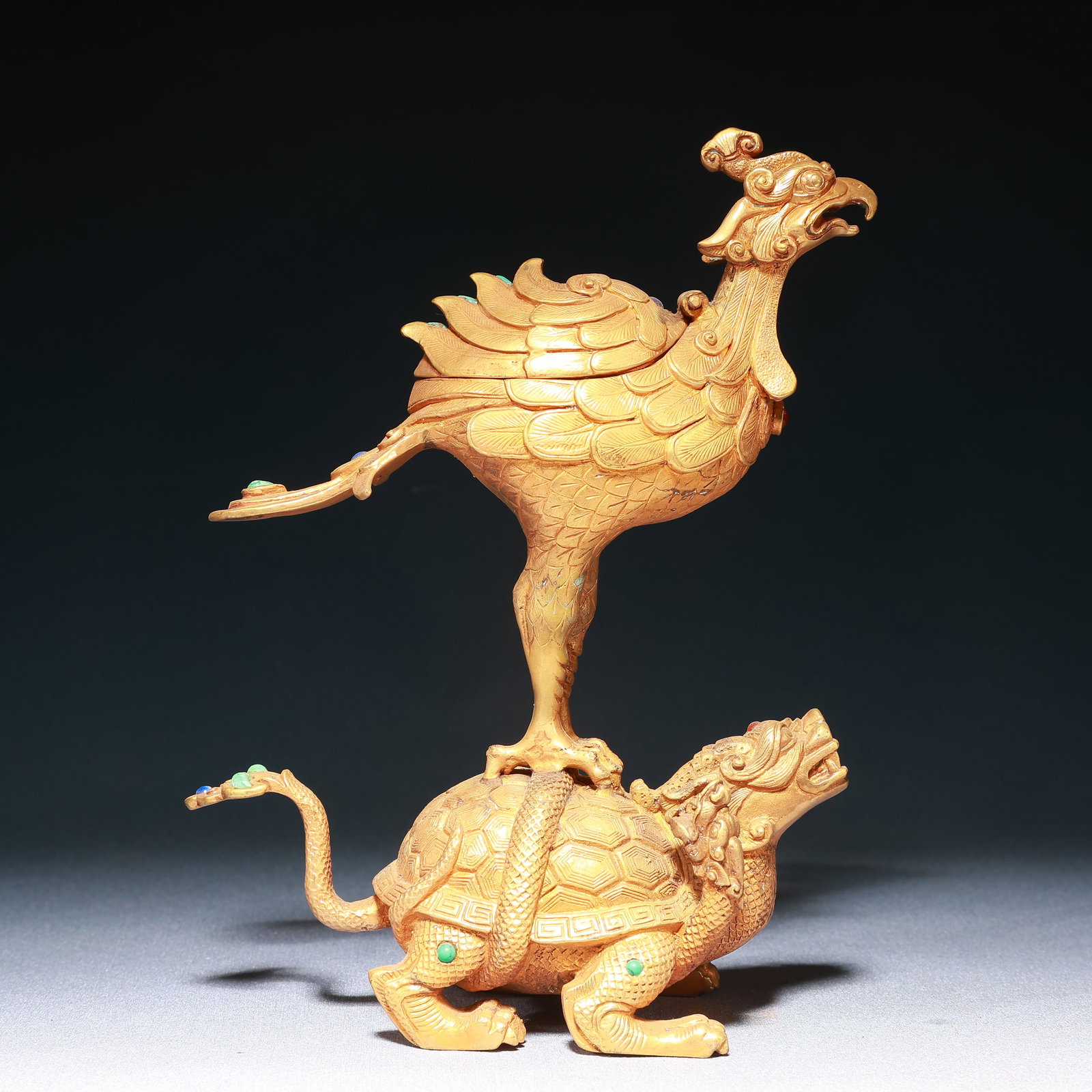 An Exquisite Gilt Bronze Phoenix Turtle Ornament,Inlaid Turquoise: An Exquisite Gilt Bronze Phoenix Turtle Ornament,Inlaid Turquoise,Qing Dynasty,China,Size:7.1inx2.8inx8.5in,Weight:1700g 铜鎏金凤凰龟摆件,嵌ಳ
