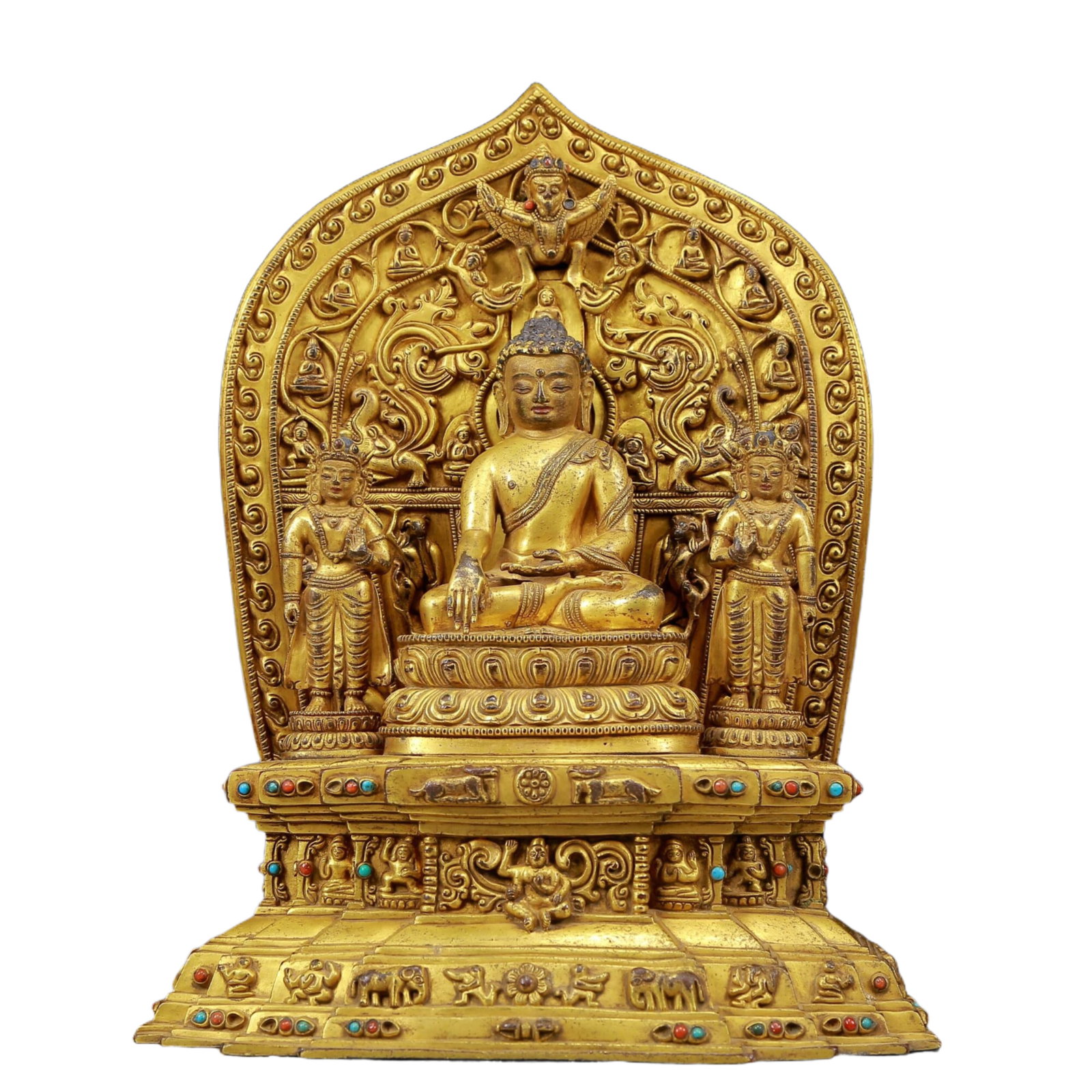 A solemn gilt bronze statue of Gautama Buddha inlaid with precious stones: A solemn gilt bronze statue of Sakyamuni with inlaid gems, Qing Dynasty, China. The Buddha's face has a calm, kind and serene expression, and his hands and fingers show beautiful lines and proportions