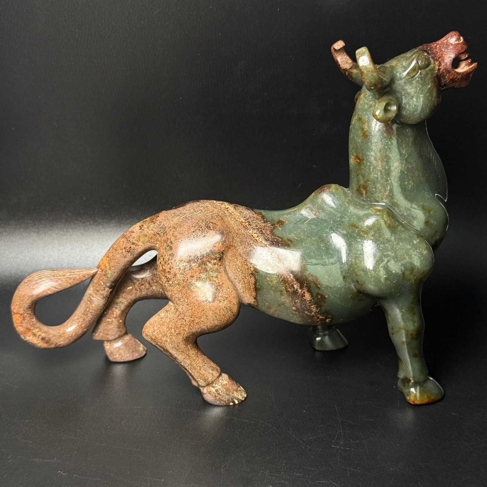 An Exquisite Greenish Jade Buffalo Ornament: An Exquisite Greenish Jade Buffalo Ornament,Qing Dynasty,China,Size:216mmx73mmx180mm,Weight:1442g 青玉牛摆件,中国清代